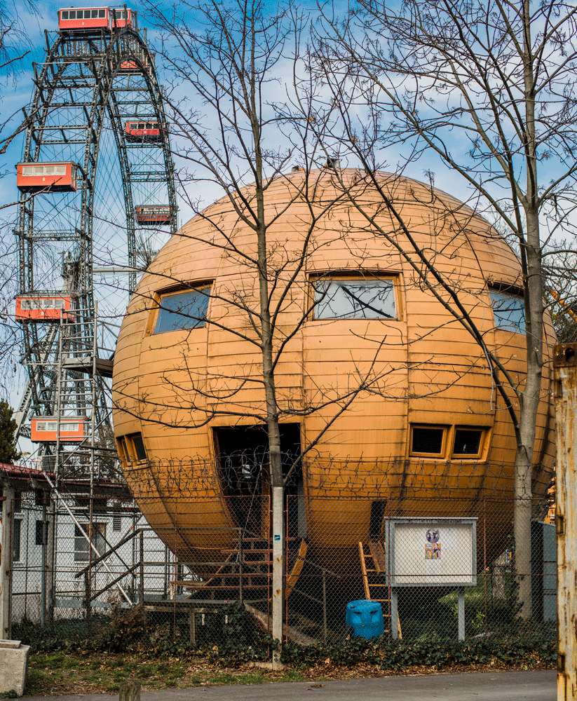 A spherical house and Ferris wheel. 