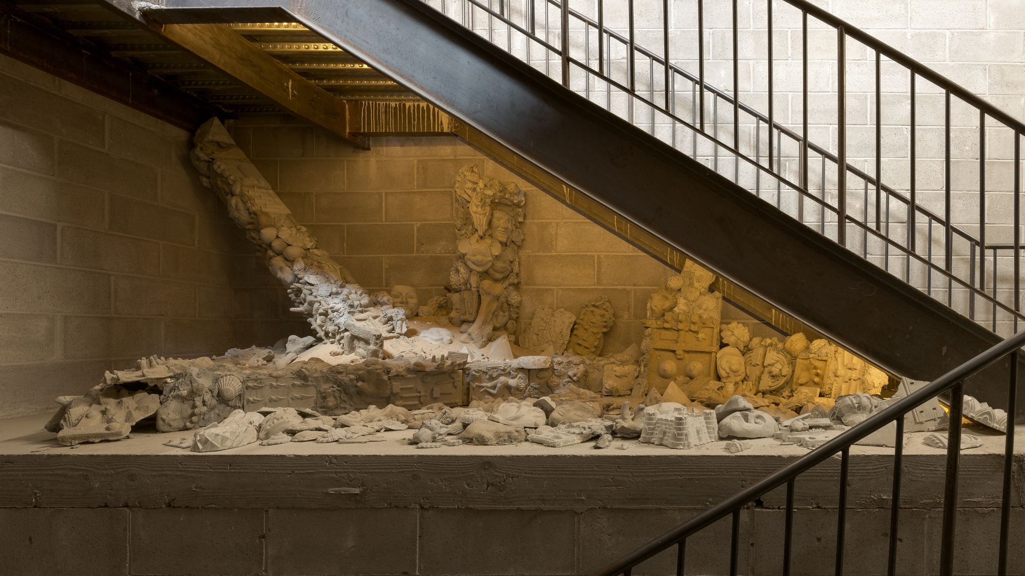 white ceramic molds on a staircase