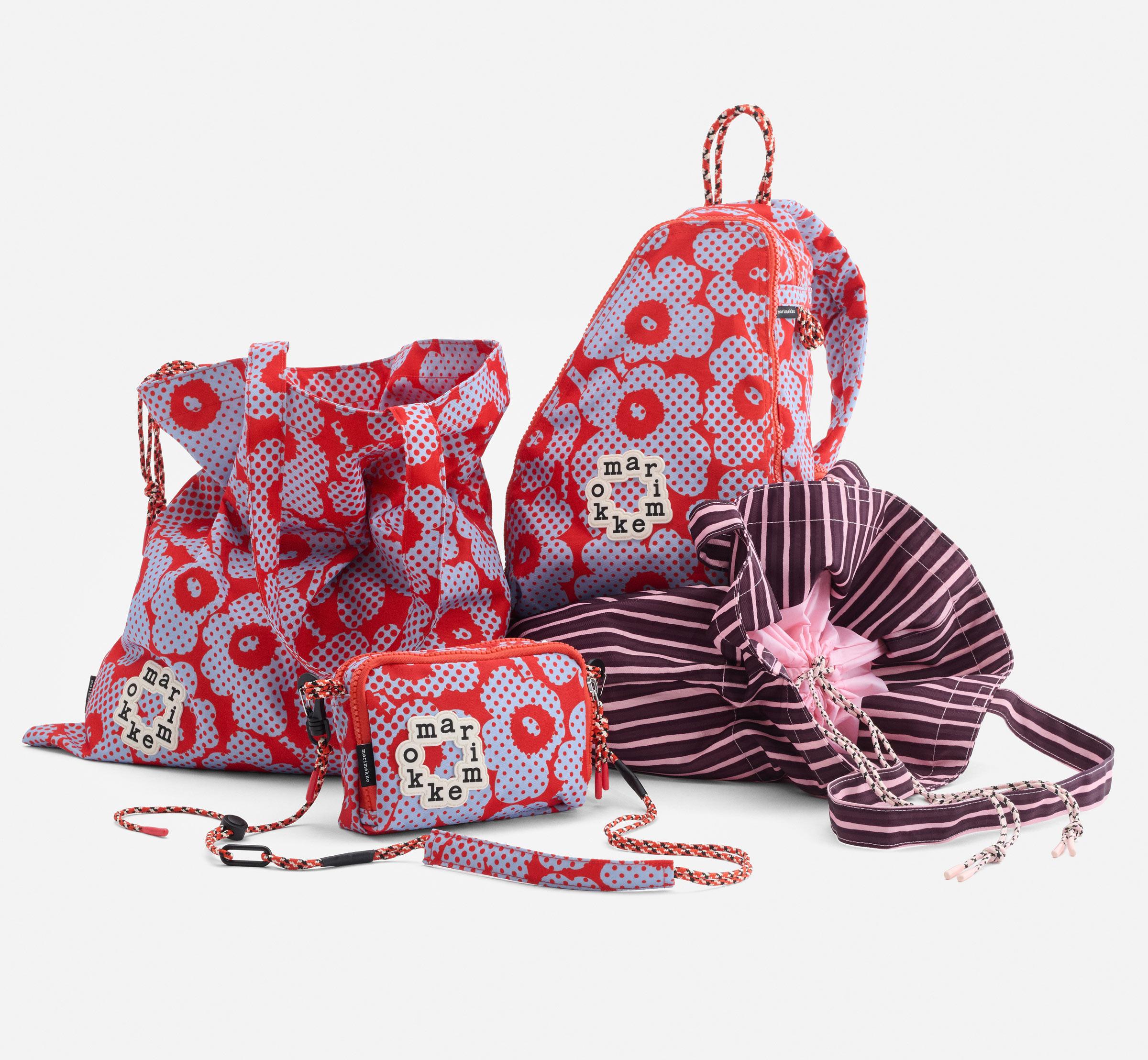 A collection of Onni bags in red and light blue Unikko pattern.