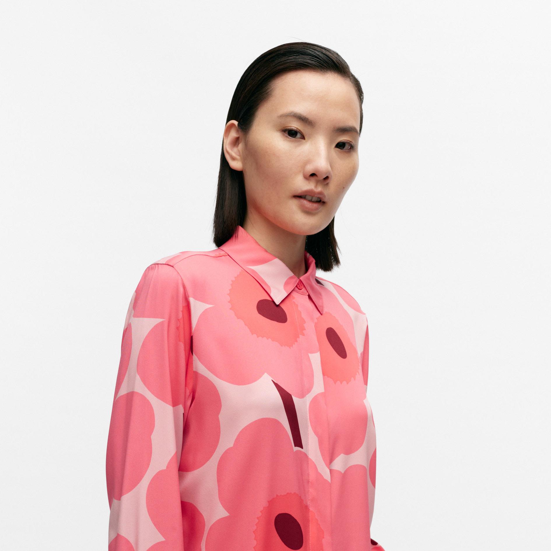 Model wearing a silk shirt in Unikko pattern.