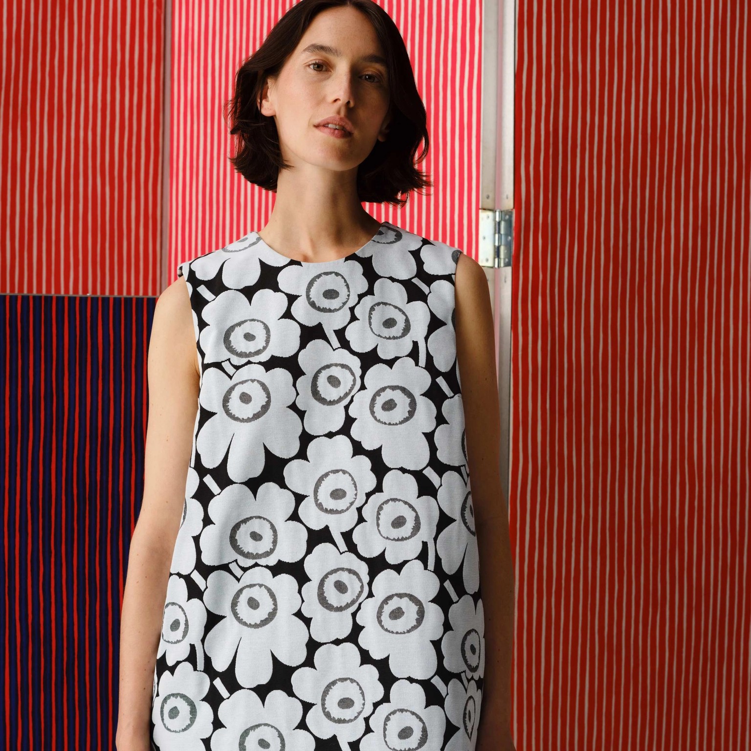 Model wearing dress in Unikko print.