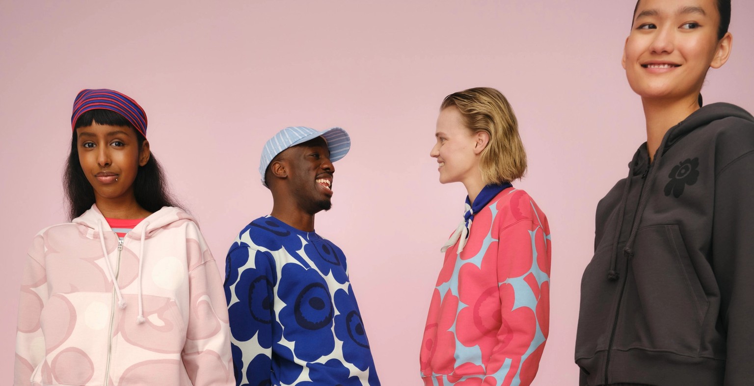 Four models wearing Marimekko sweatshirts, hoodies and sweatpants in joyful colors and prints.