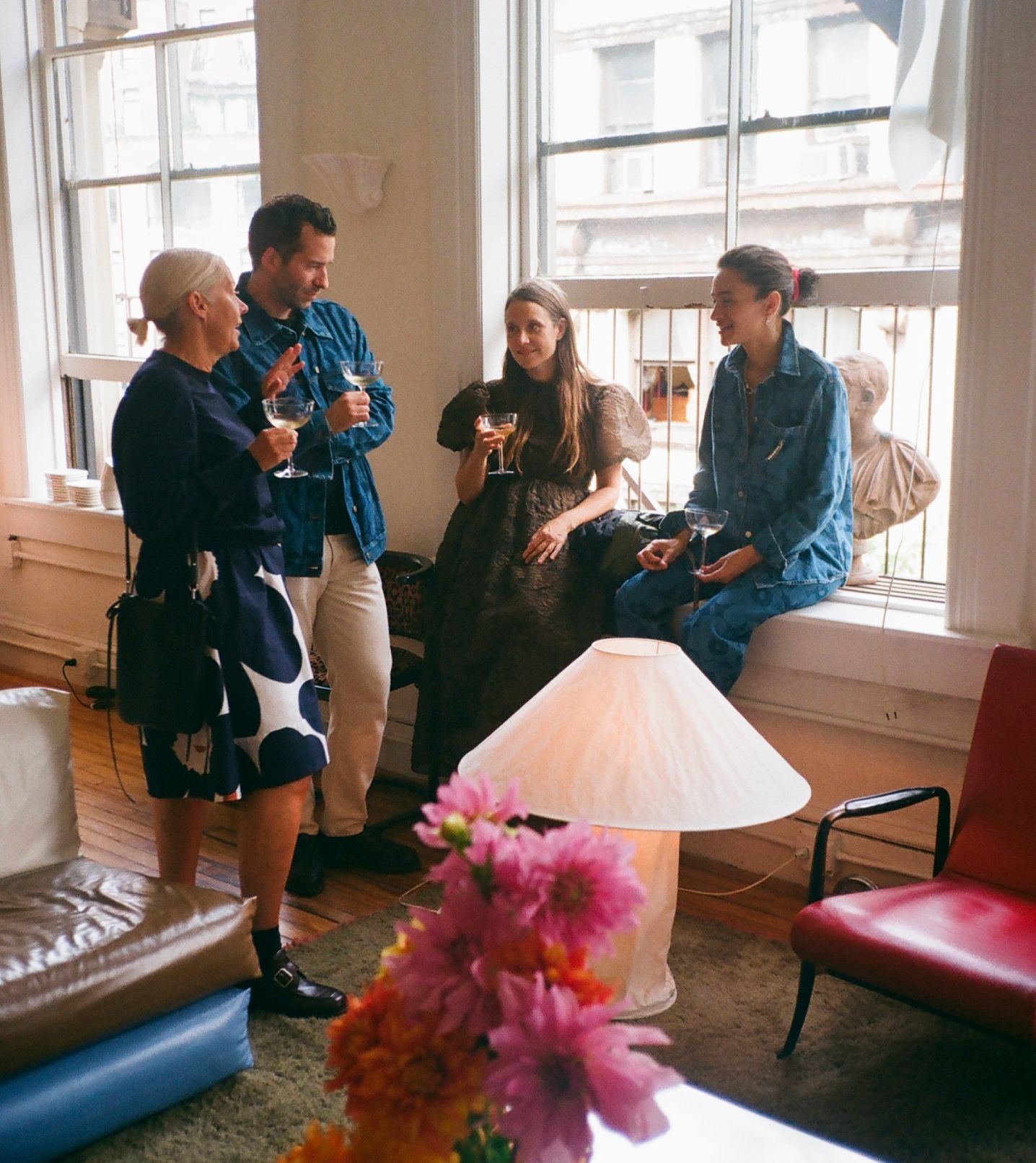 Lunch guests enjoying a drink at Laila Gohar's apartment