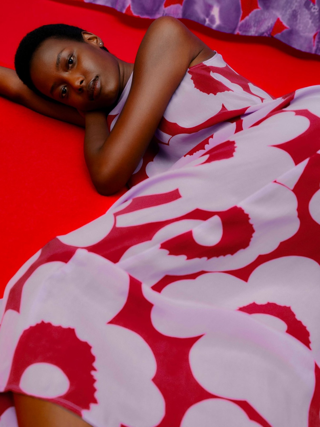 Model wearing Migot dress in Unikko print.