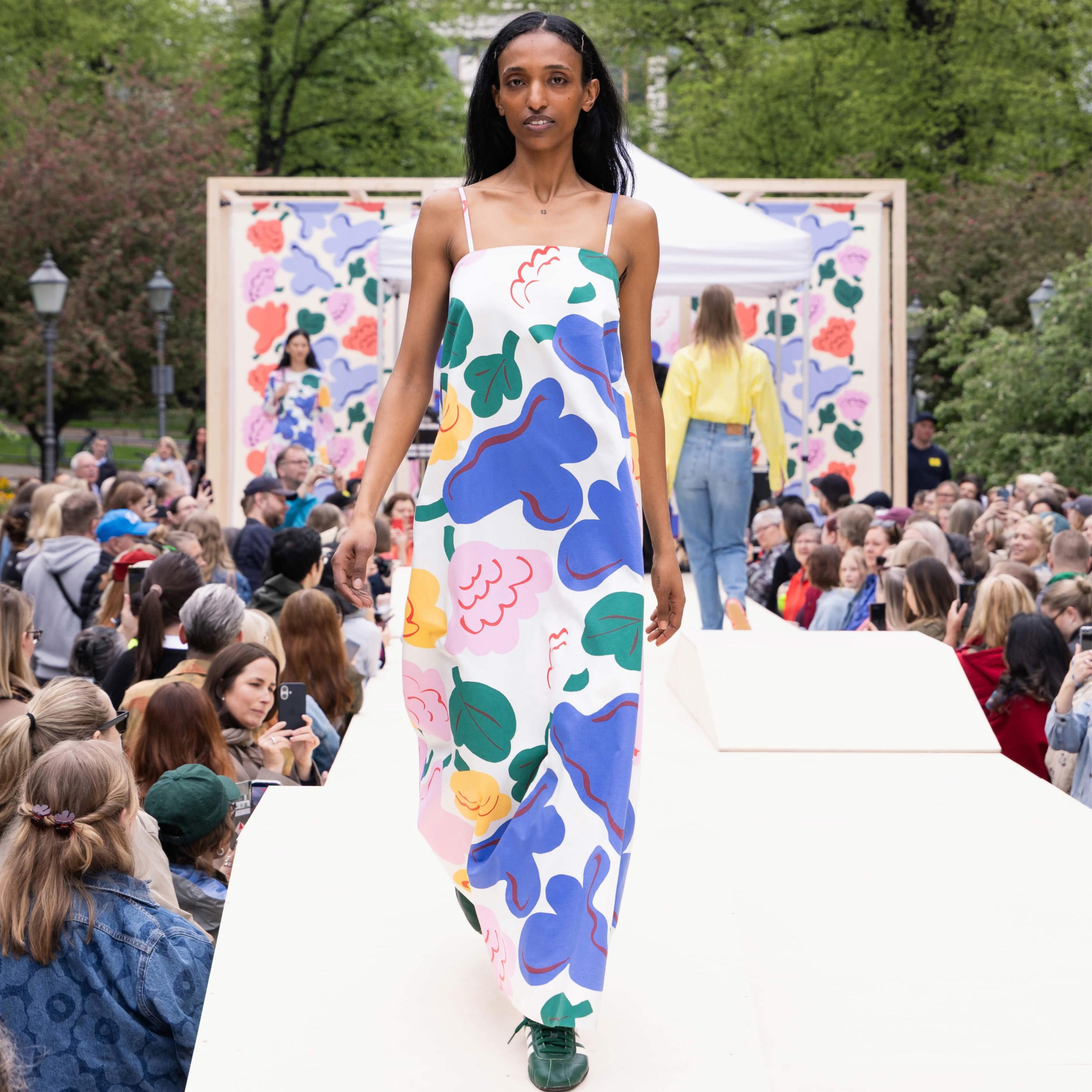 The Marimekko Day model walks on stage