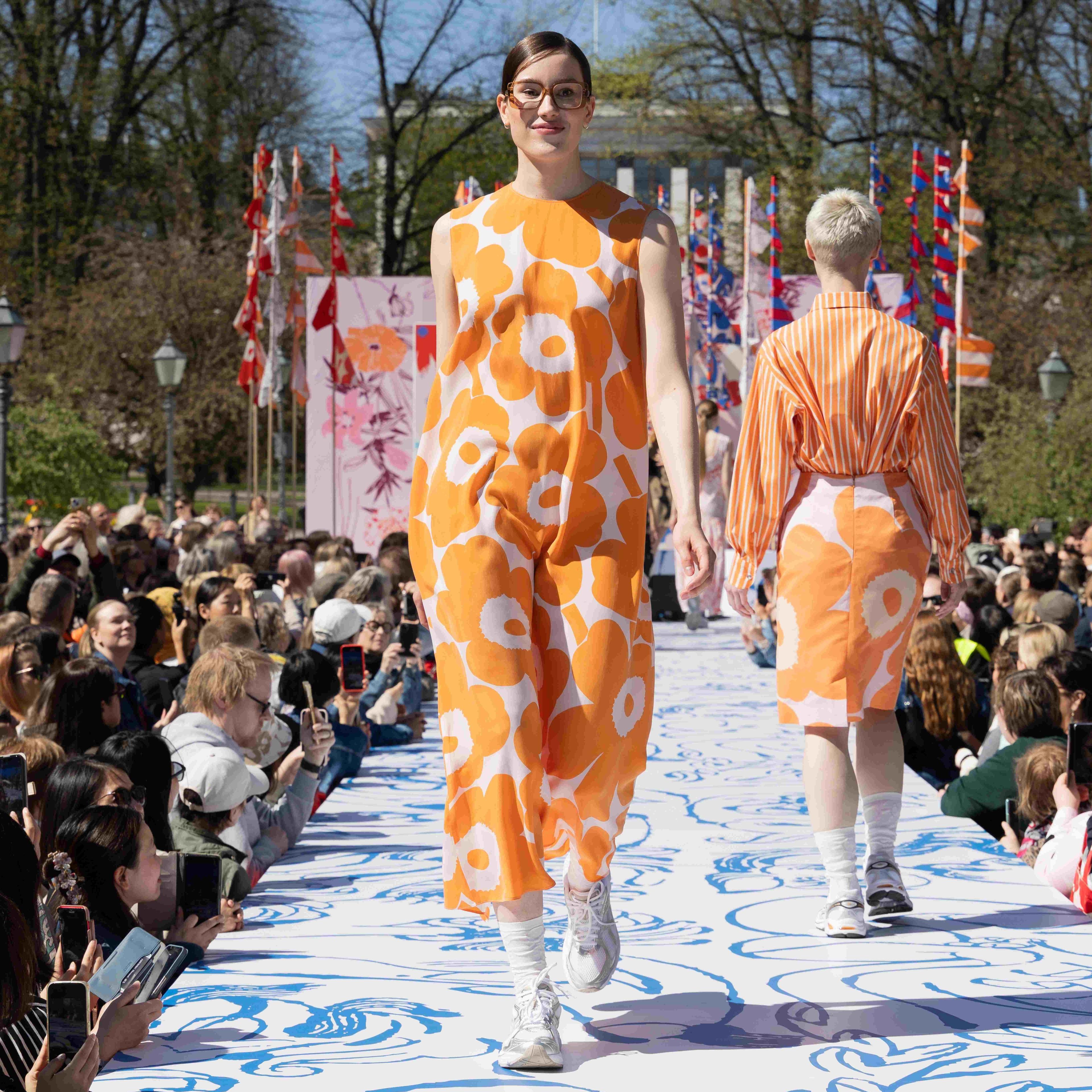 Model wearing Migot dress in Unikko print.