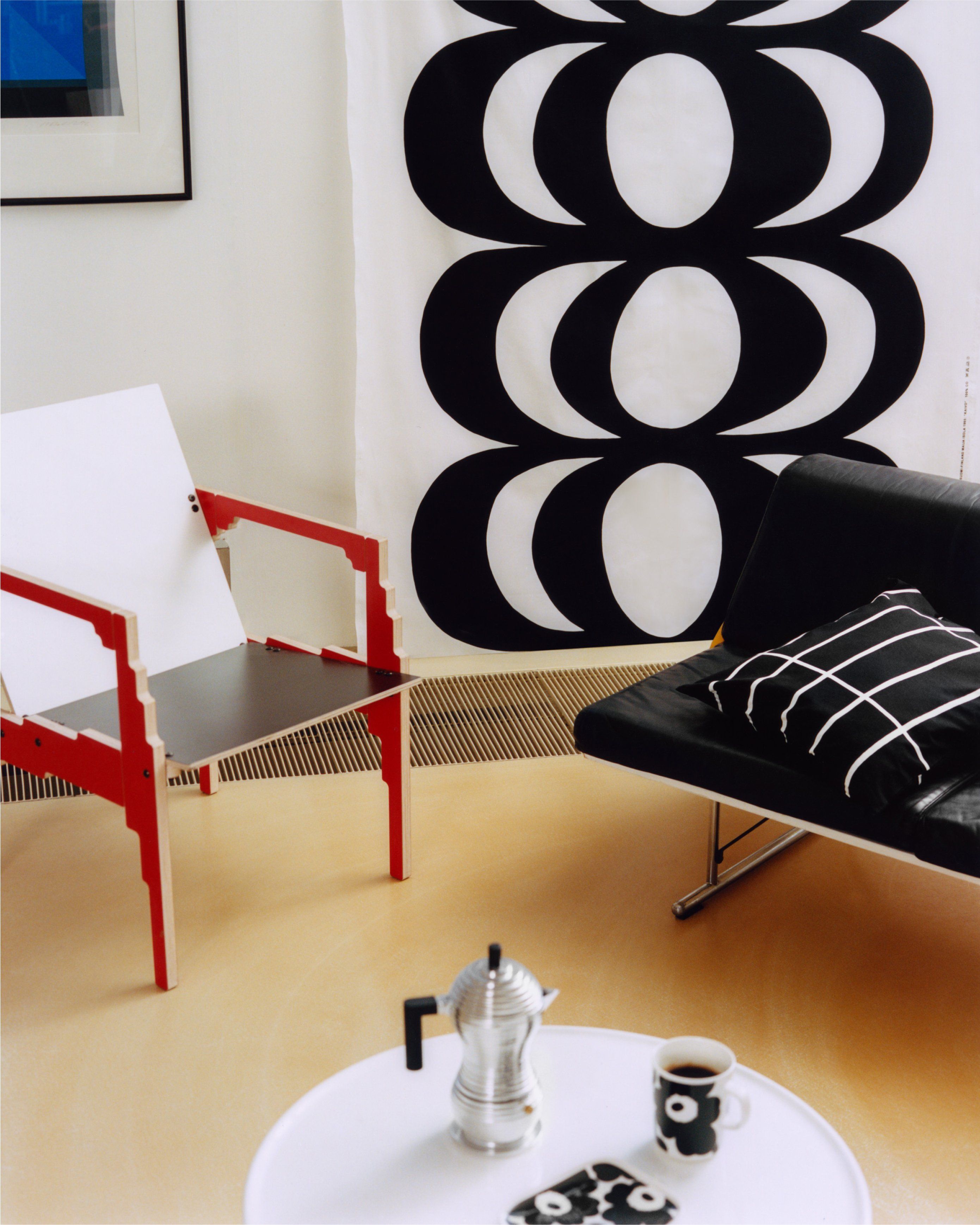 Fabric in Kaivo-print hanging on the wall.