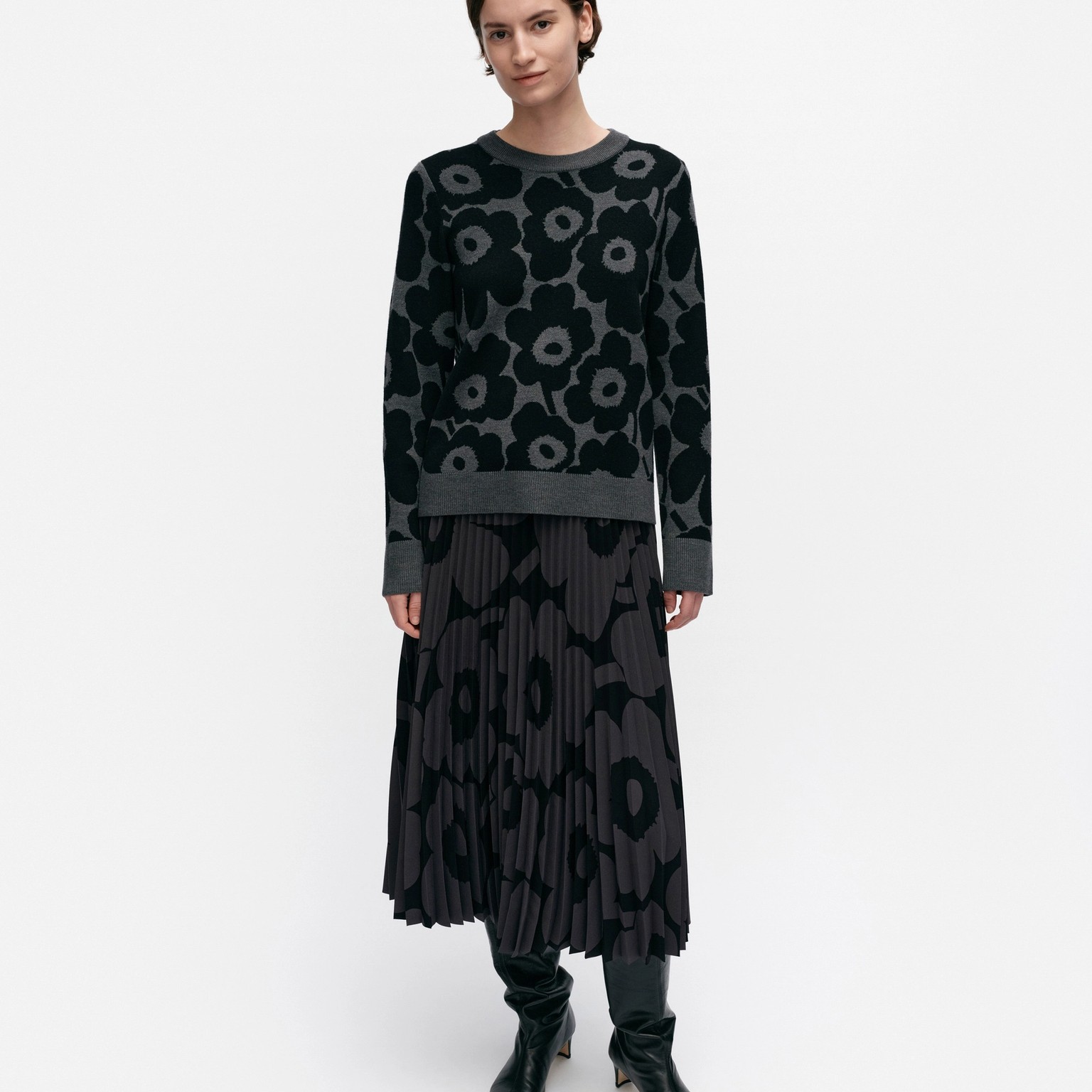 Model wearing wool knit in Unikko pattern.