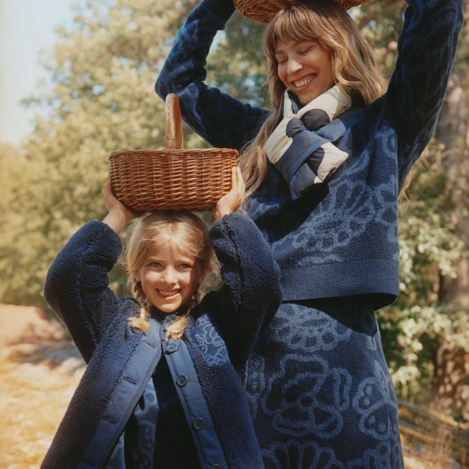 Adult and child wearing Marimekko Uniqlo collaboration clothing