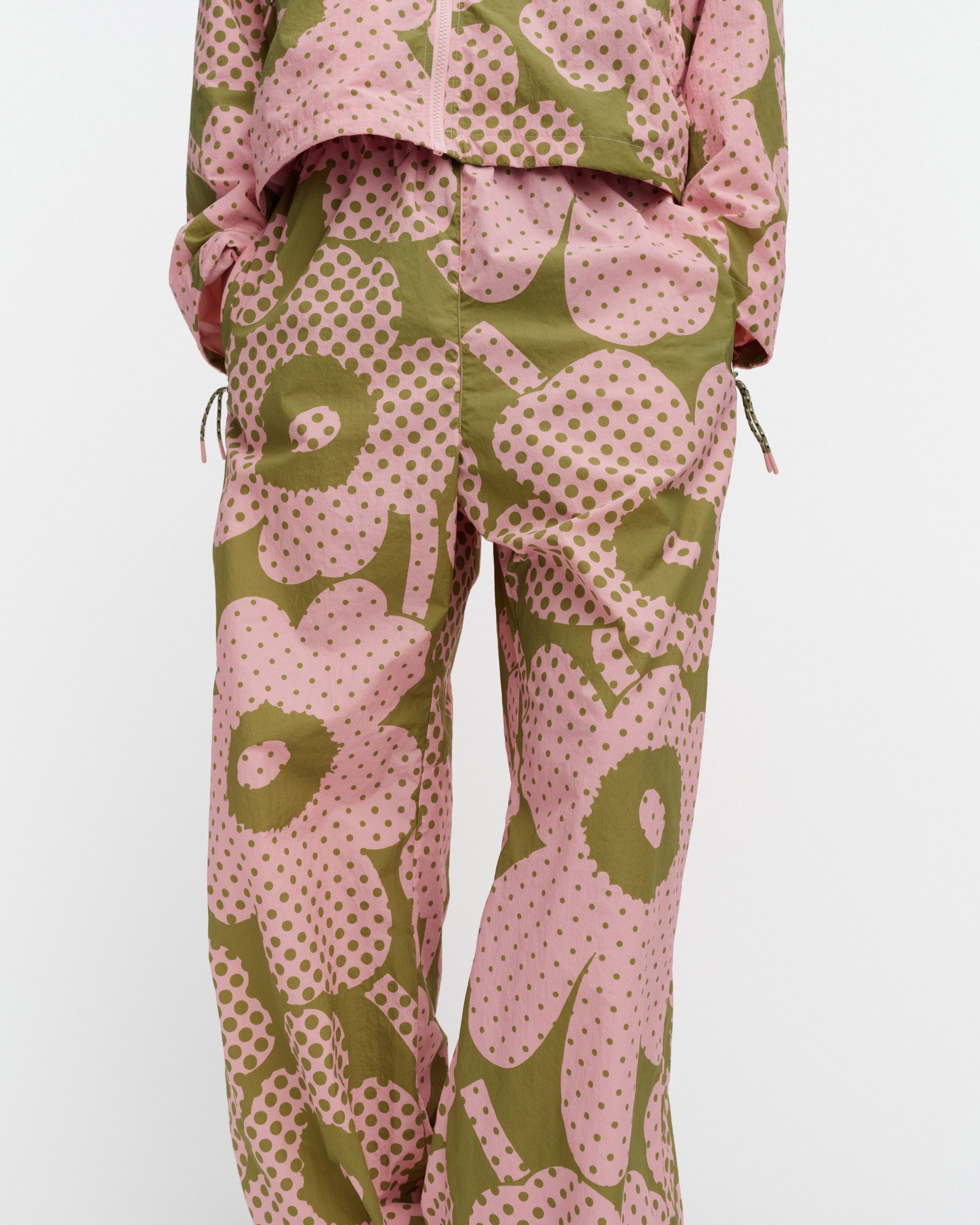 Olos Unikko Kioski activewear trousers green, light pink | Marimekko