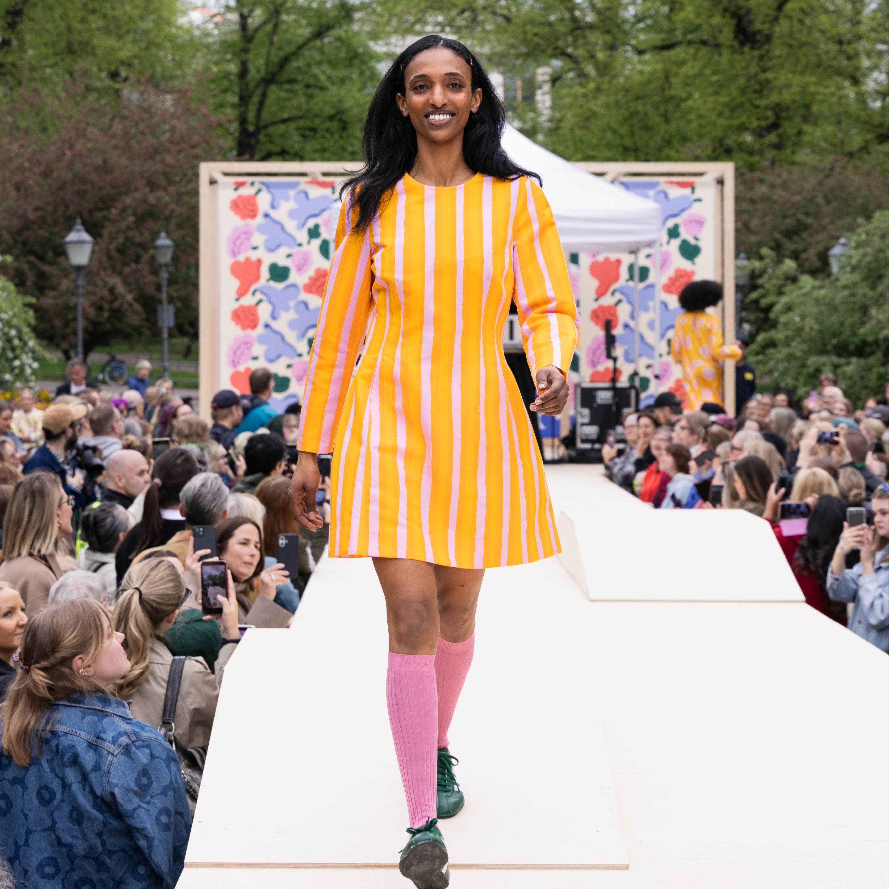 The Marimekko Day model walks on stage