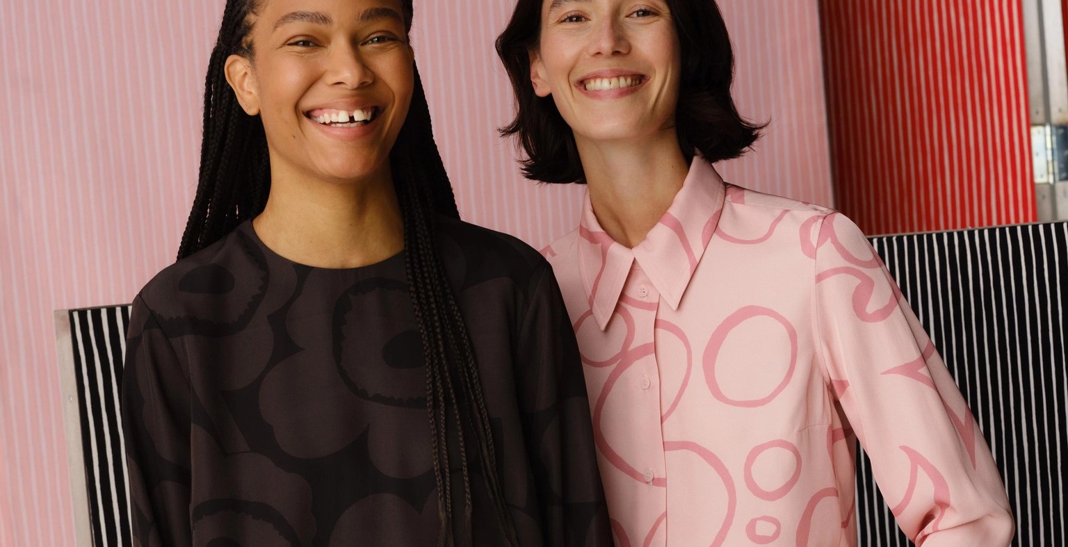 Models wearing a black Hienous dress in Unikko print and a pink set in Keidas print.