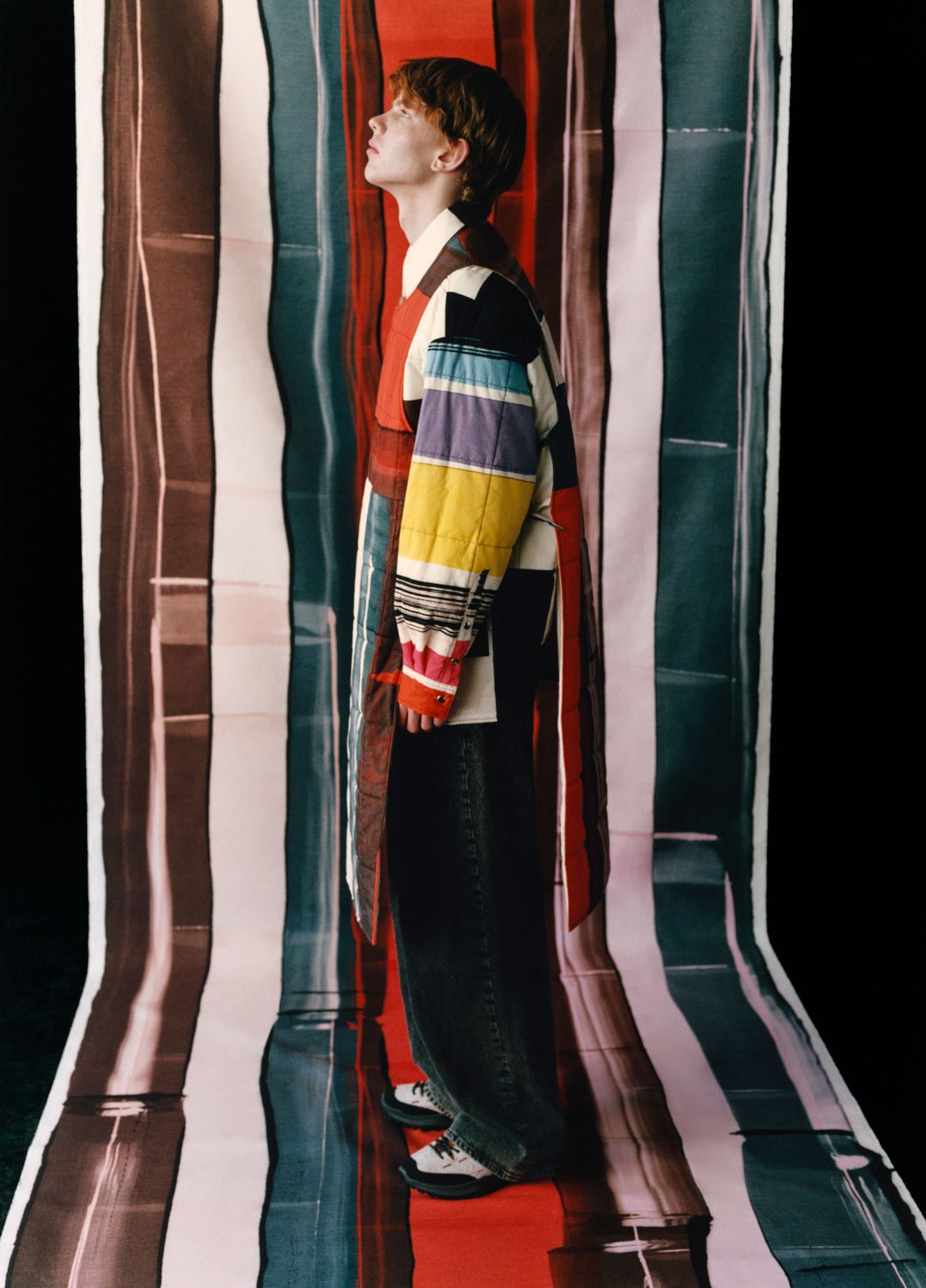 The model is standing on the fabric and is wearing a Hanko jacket.