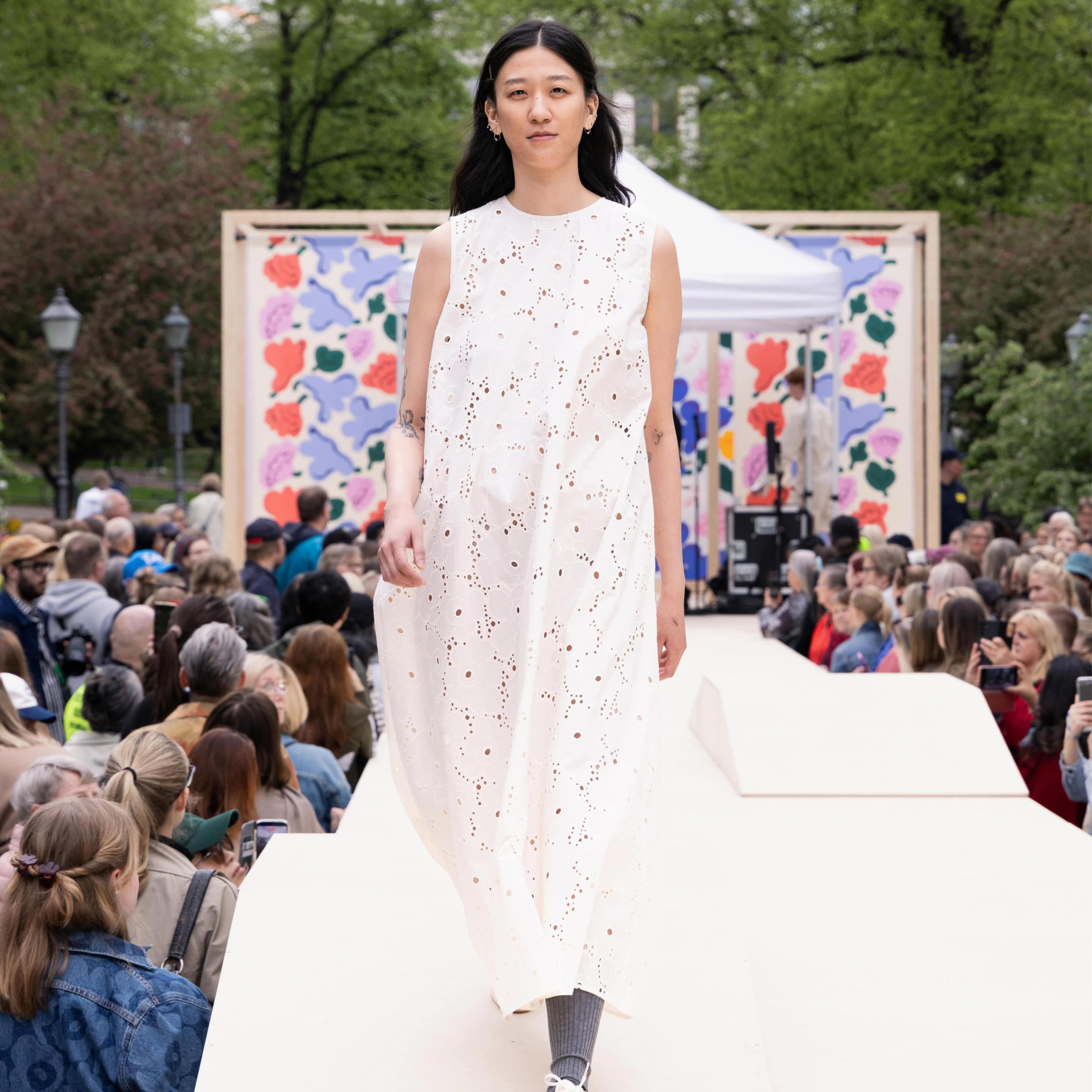 The Marimekko Day model walks on stage