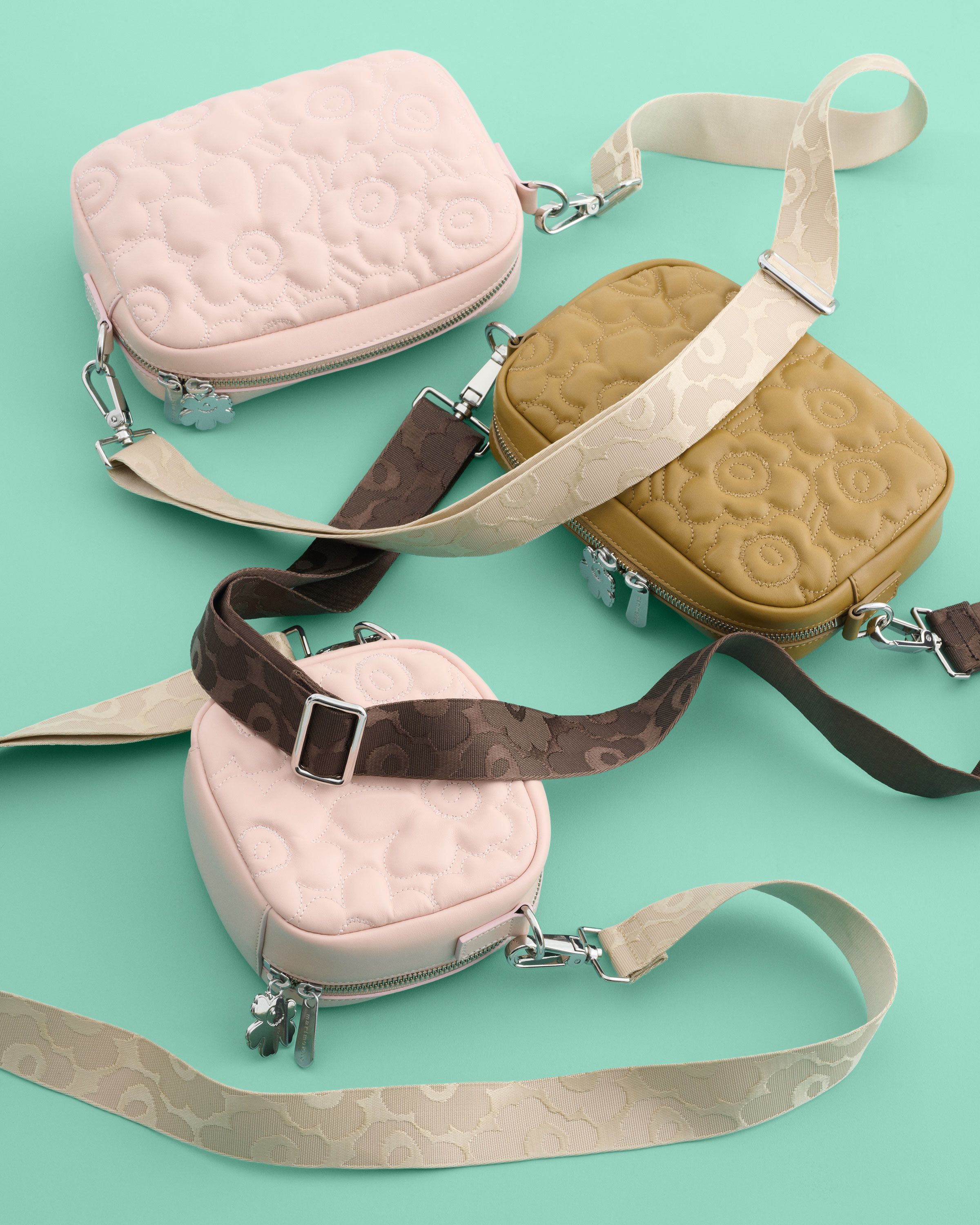 Two pink and one light brown Gratha bags.