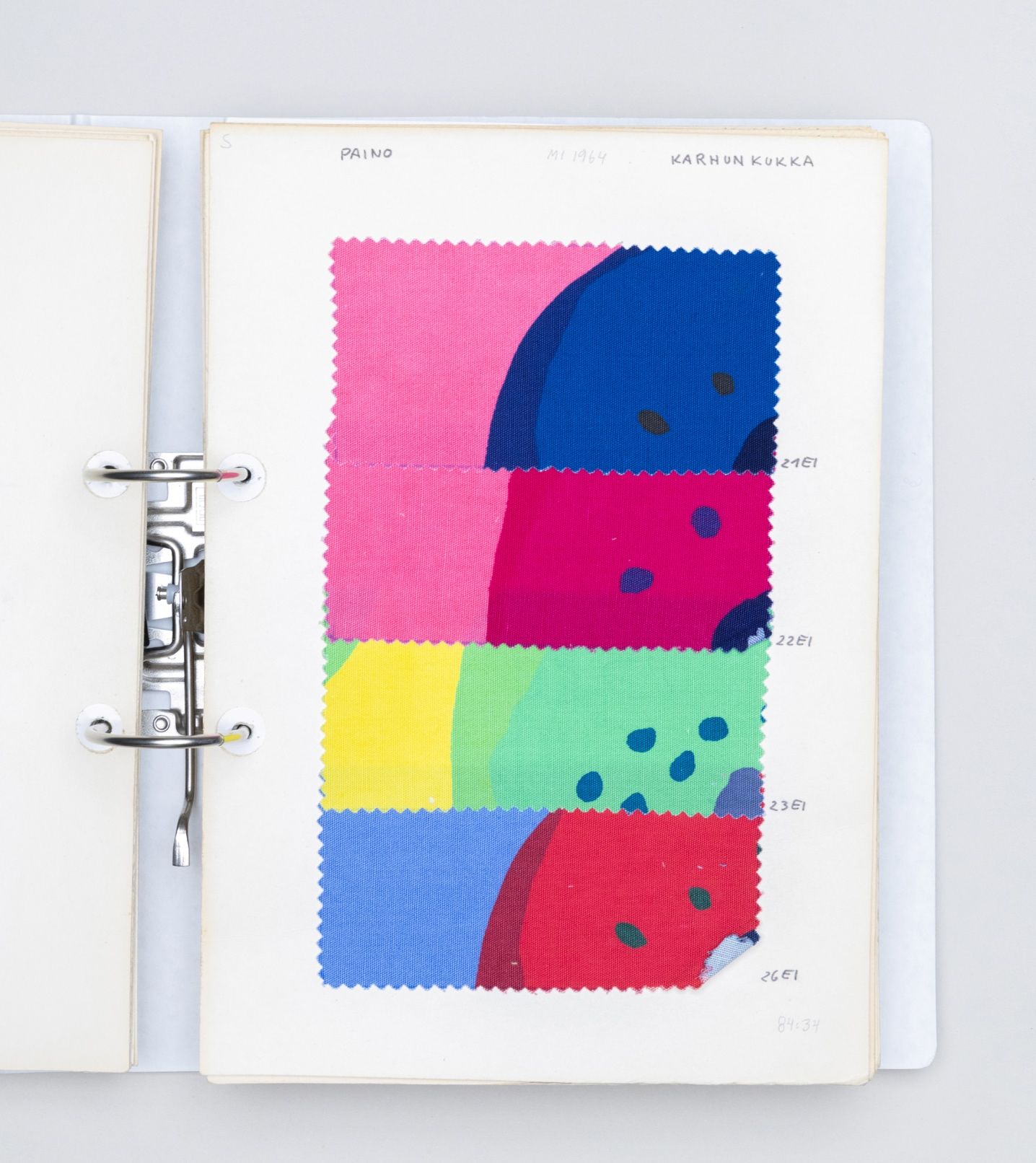 Folder with patched of colorful fabric.