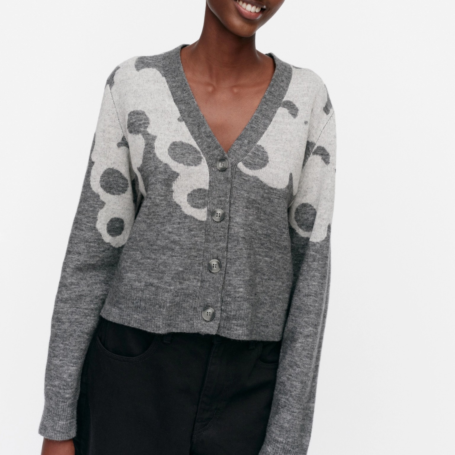 Model wearing grey knit