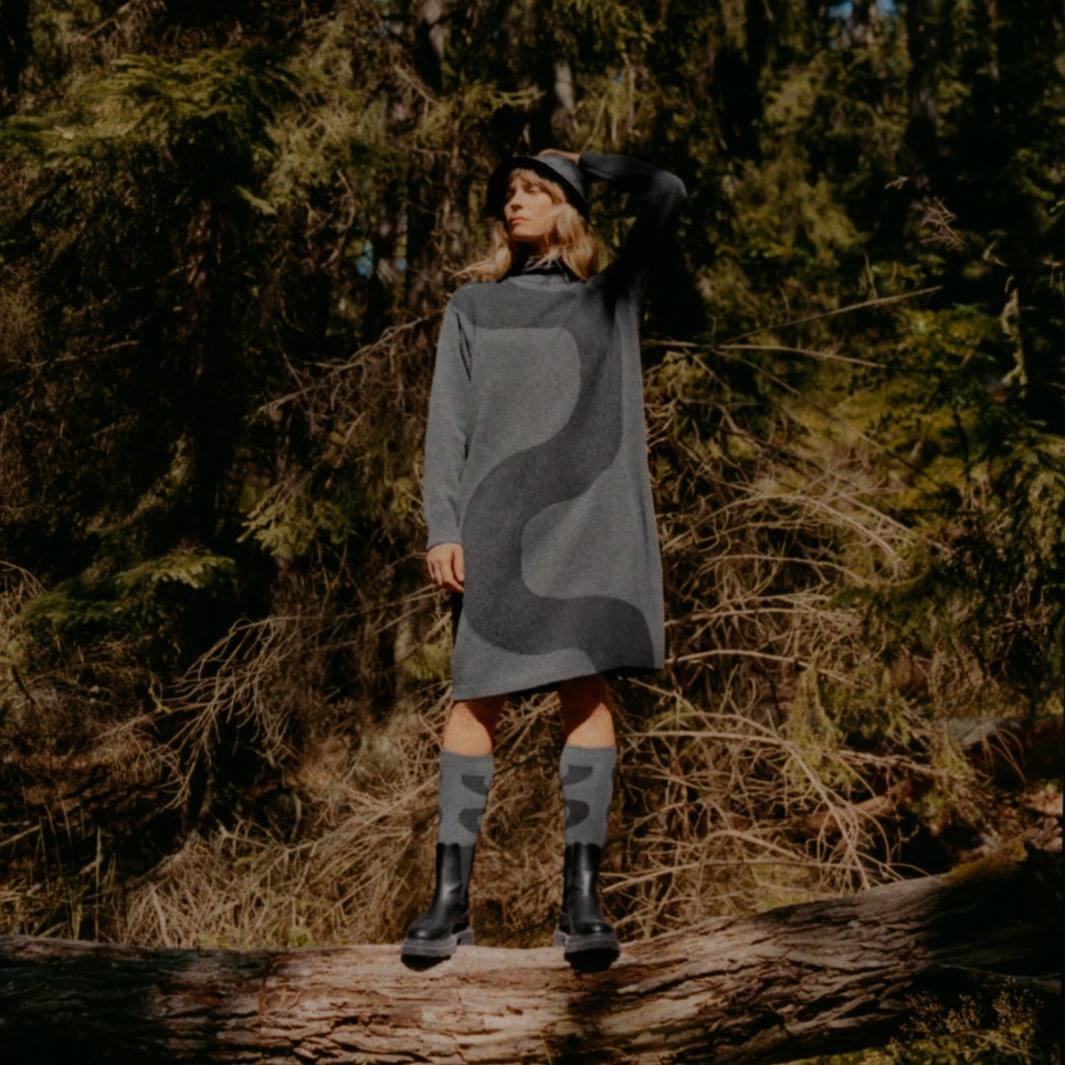 Model wearing Uniqlo and Marimekko collaboration dress, socks and bucket hat in grey color