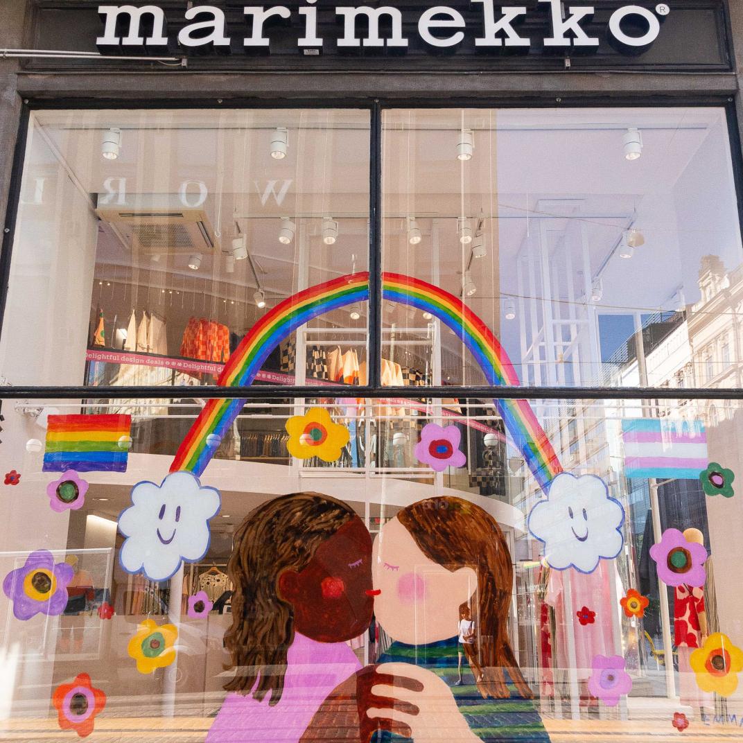 Emma Thomas's pride art window reflecting a kiss at Aleksinkulma store