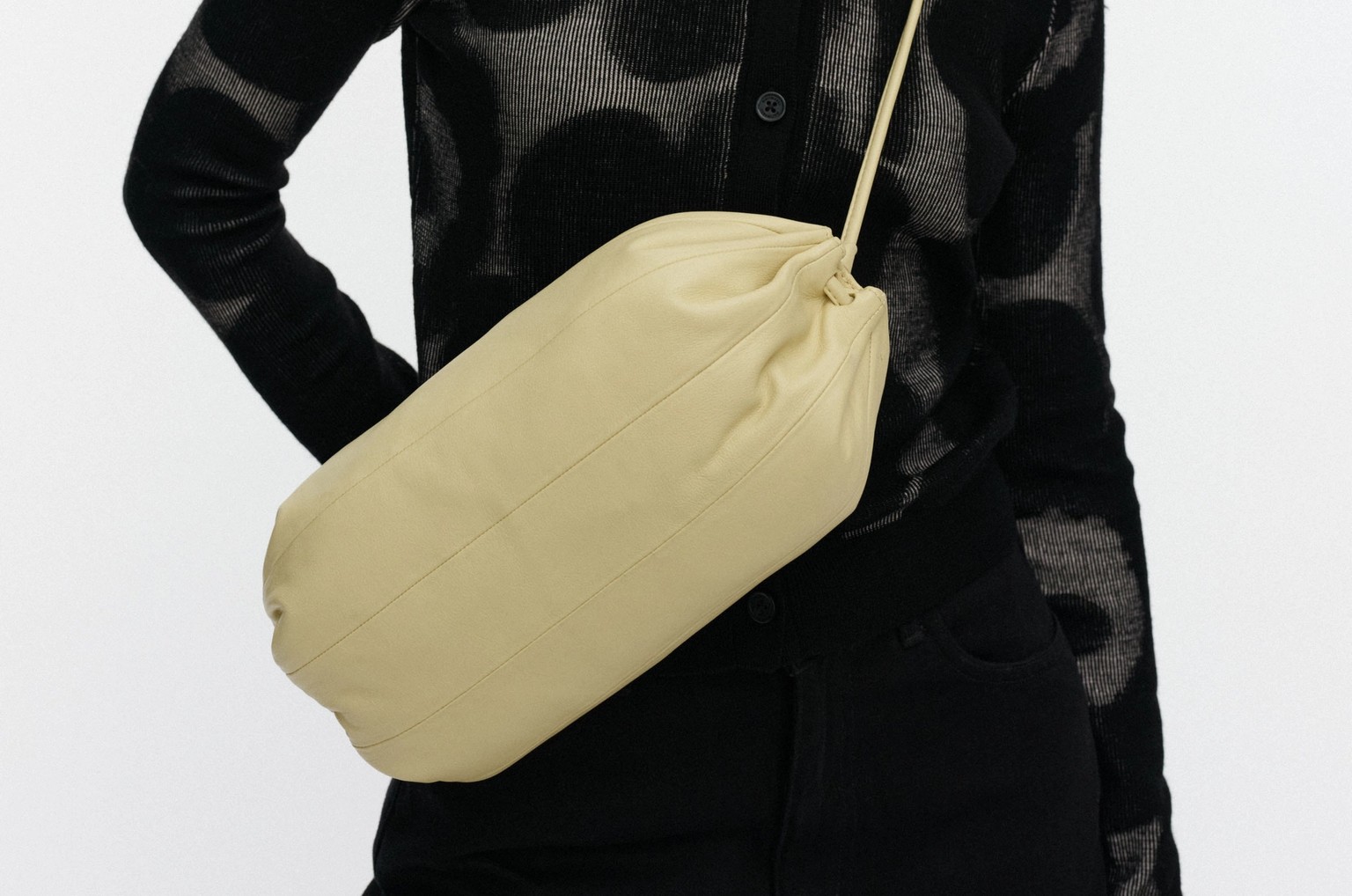 Model wearing a yellow leather Karla shoulderbag.