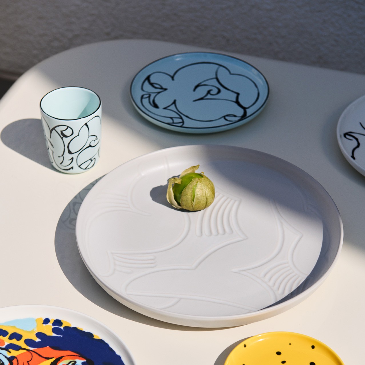 Table setting with Petra Börner collaboration plates and cup.