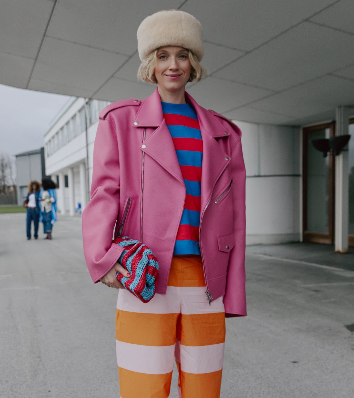 Pernille Rosenkilden wearing red and blue Marimekko stripe t-shirt and pink and orange Marimekko stripe trousers.