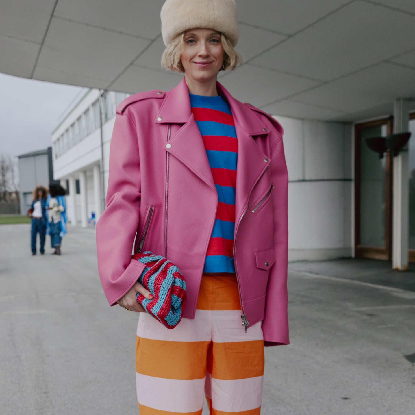 Pernille Rosenkilden wearing red and blue Marimekko stripe t-shirt and pink and orange Marimekko stripe trousers.