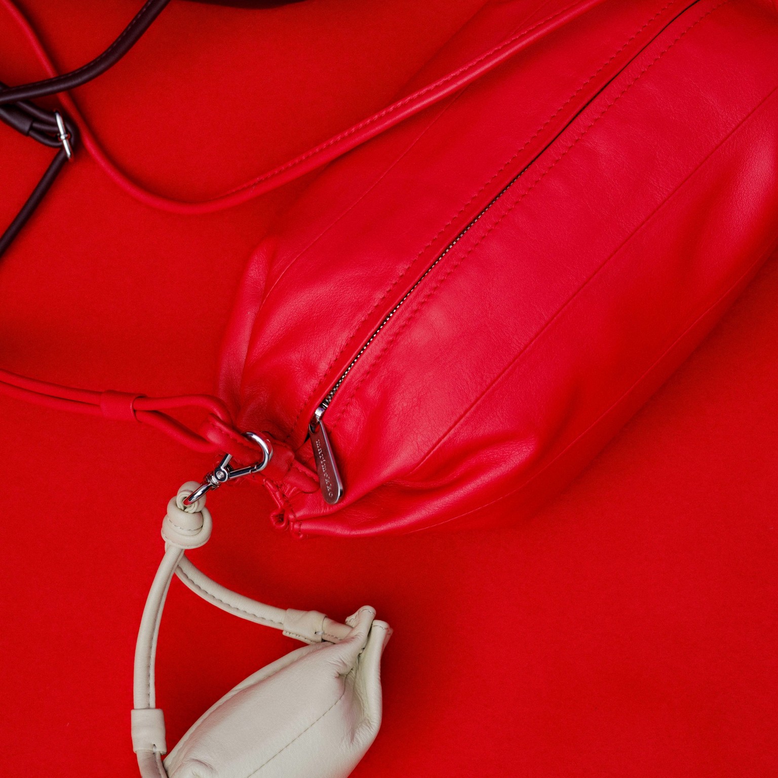 Karla, Pikku Karla and Karla Pocket bags in red, brown and white