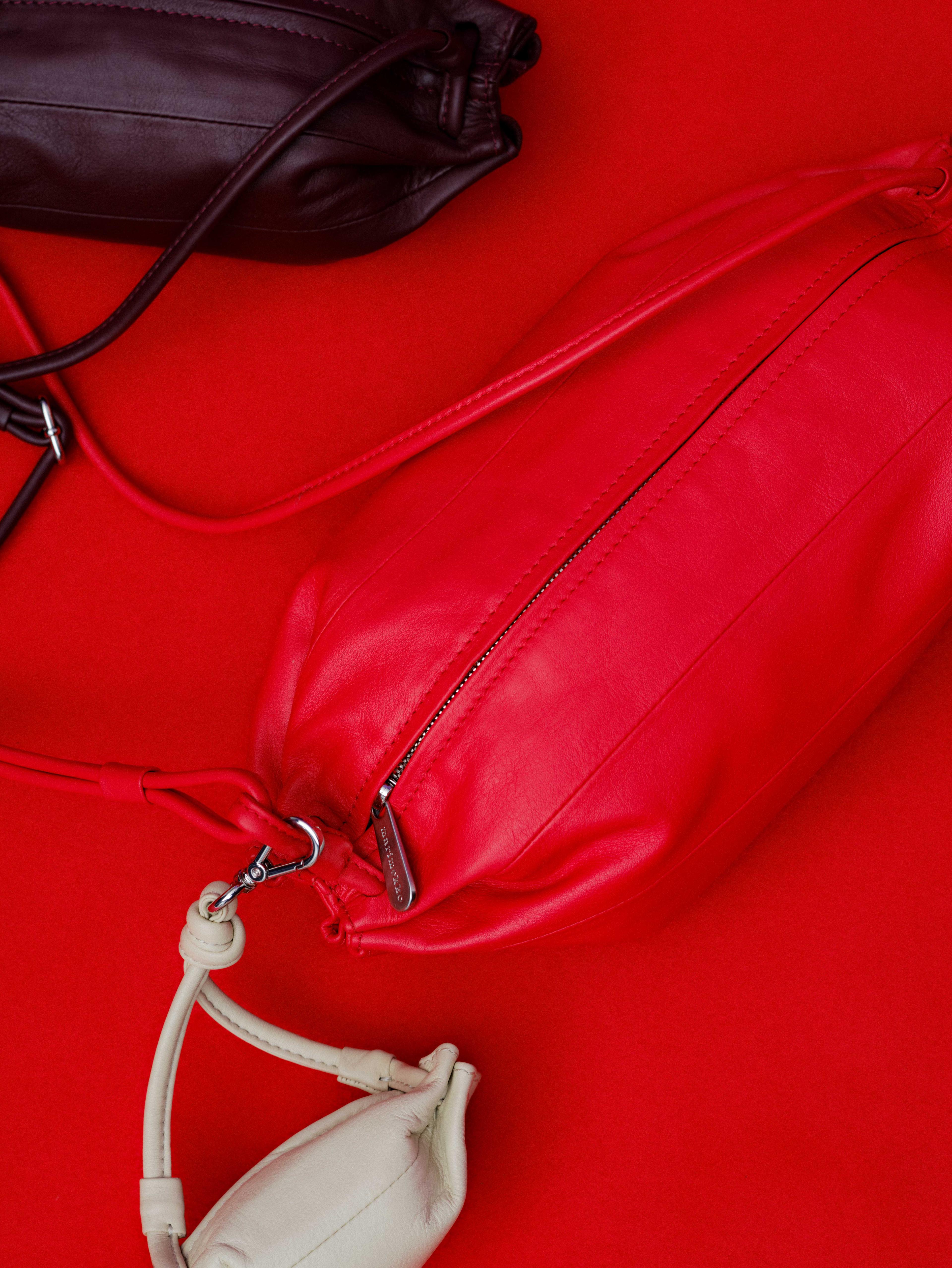 Karla, Pikku Karla and Karla Pocket bags in red, brown and white