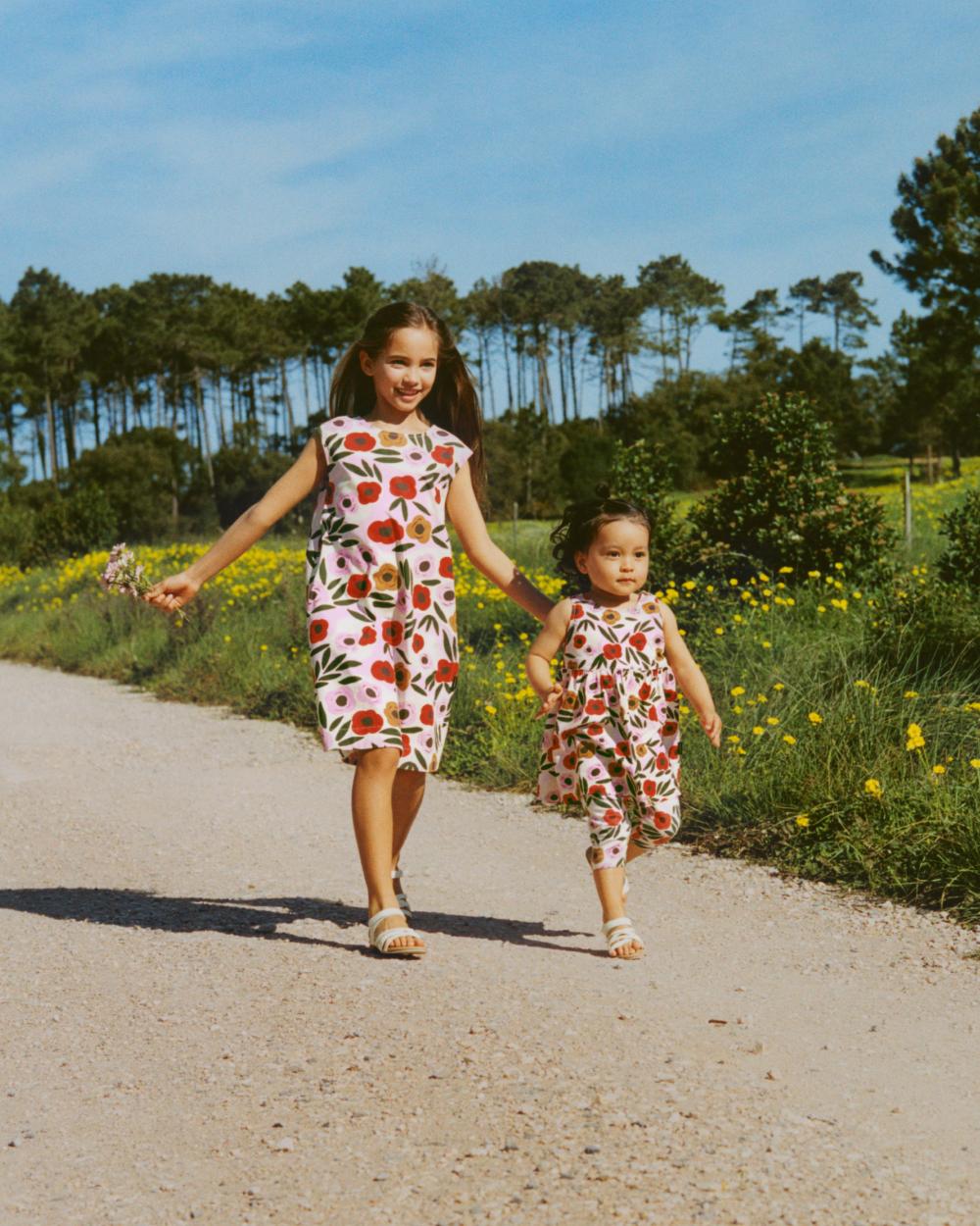 Two girls wearing dresses with Ruukku pattern from Uniqlo and Marimekko collaboration
