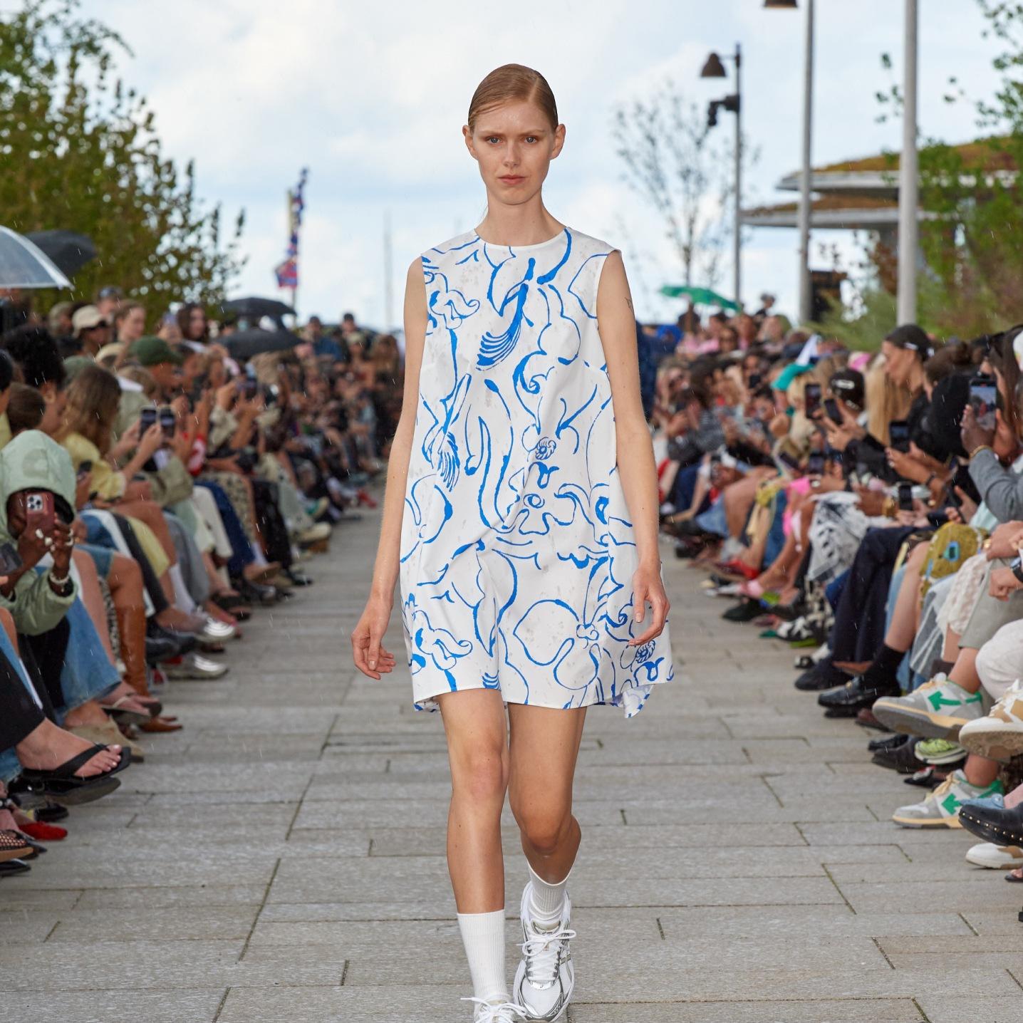 Model dressed in a blue and white Marimini dress at a fashion show in Copenhagen