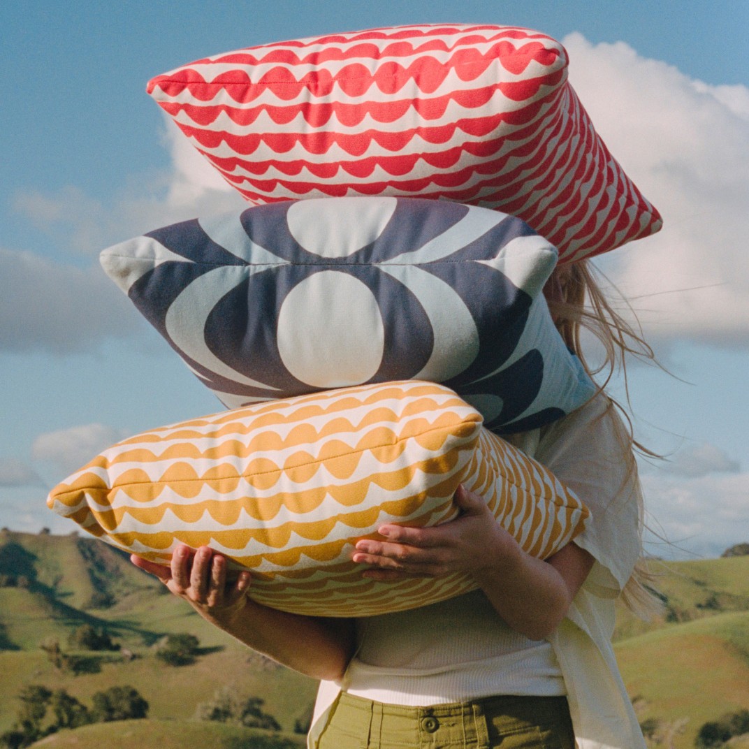 West Elm and Marimekko collaboration cushion covers in red, yellow and blue