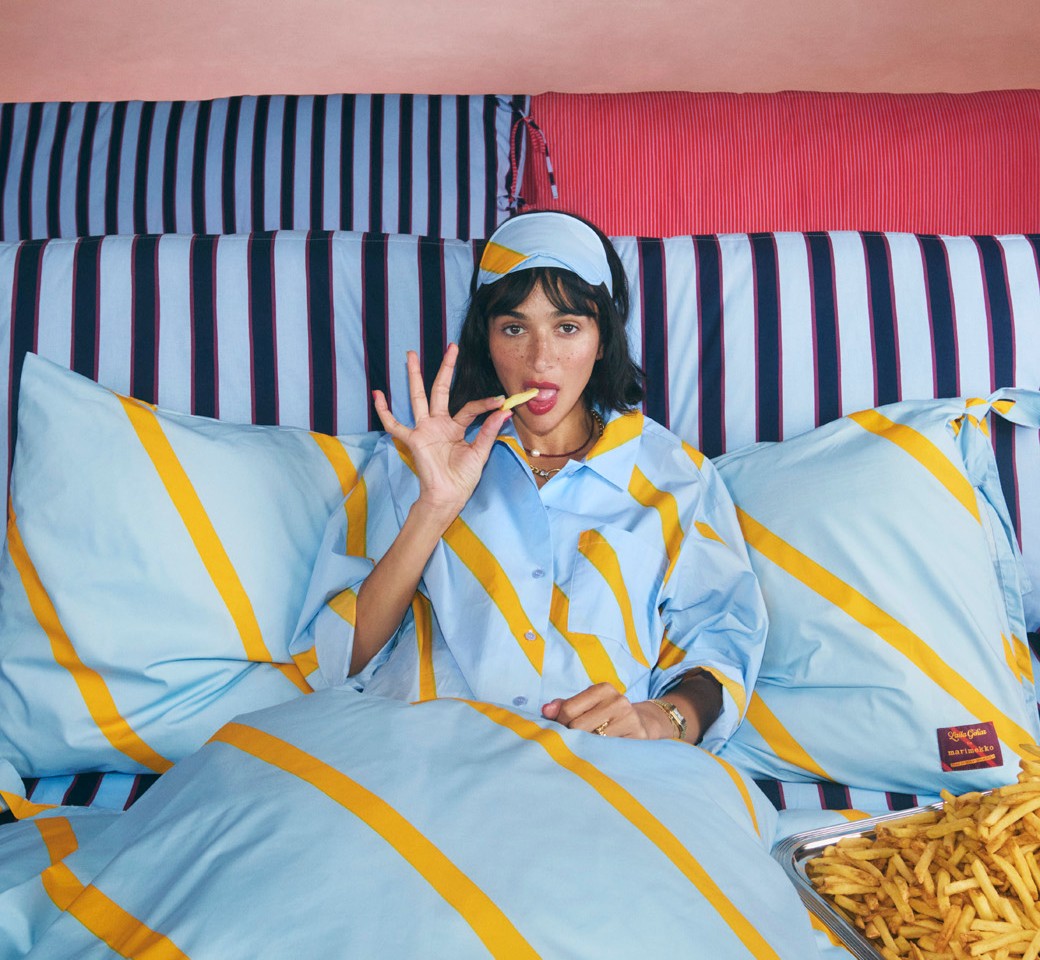 Laila Gohar in pyjamas eating french fries