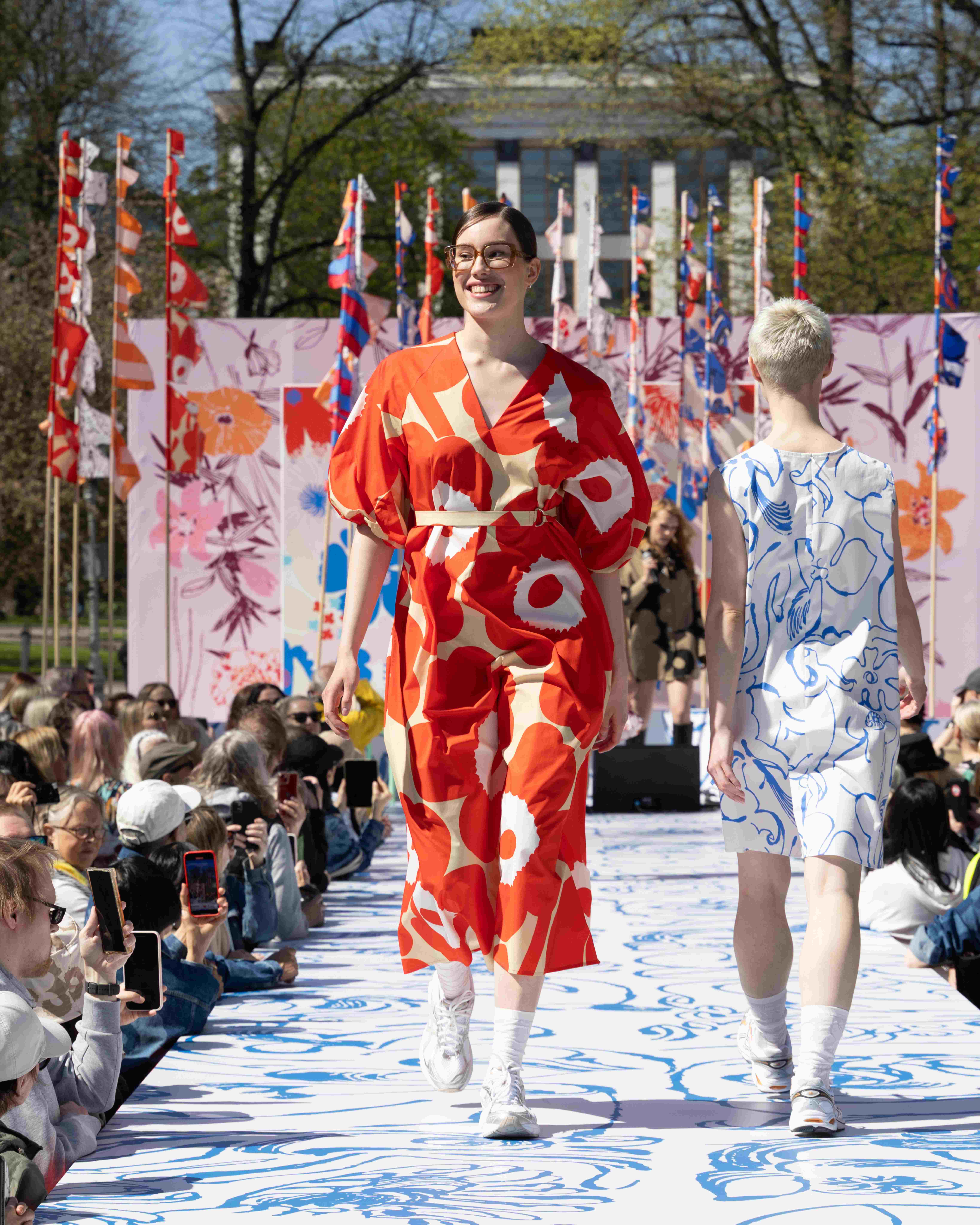 Model wearing Kimppu dress in Unikko print.