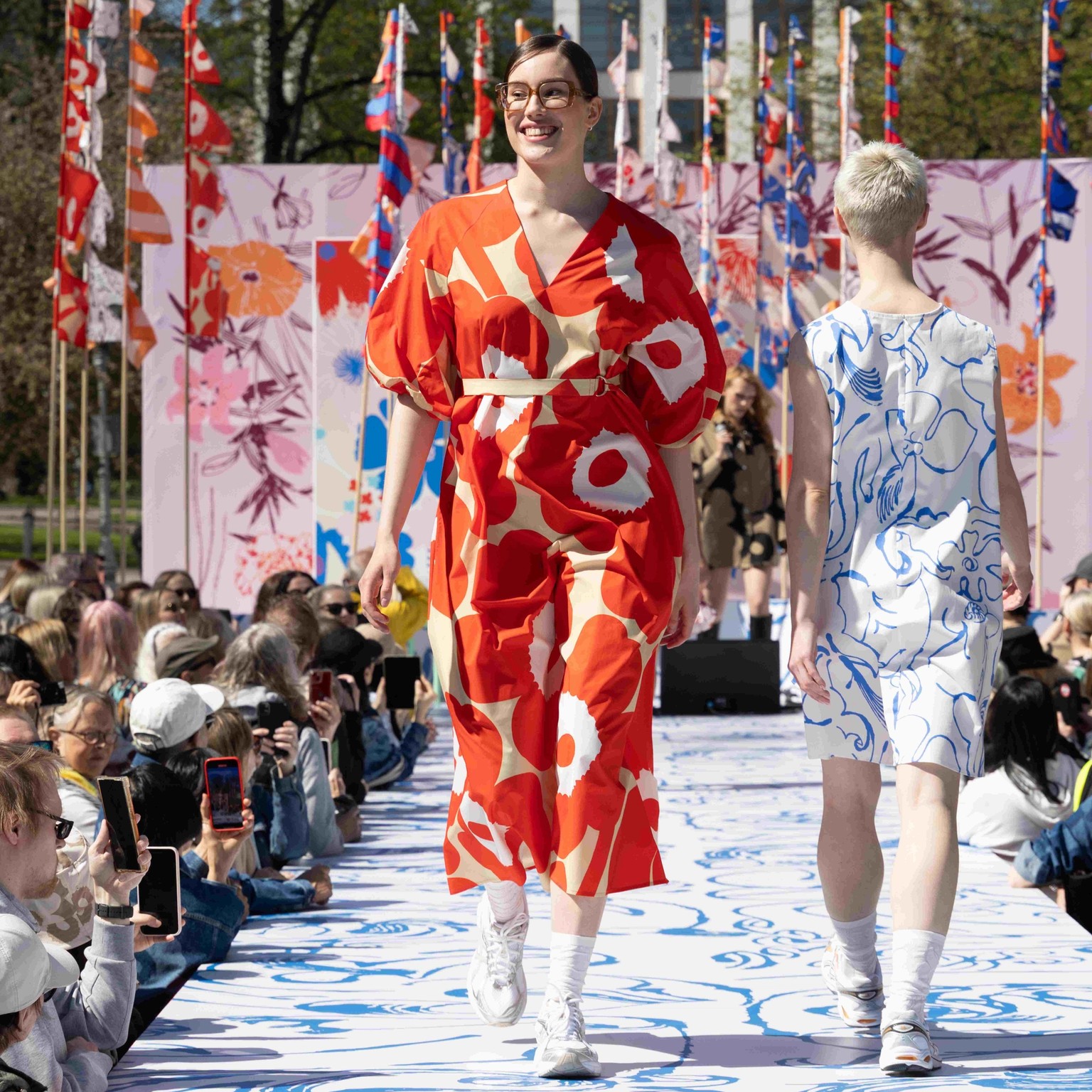 Model wearing Kimppu dress in Unikko print.