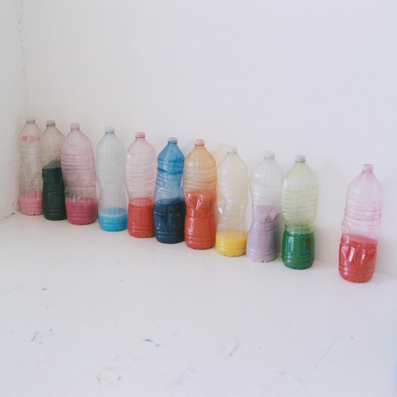 Paint bottles in Landon Metz' studio.