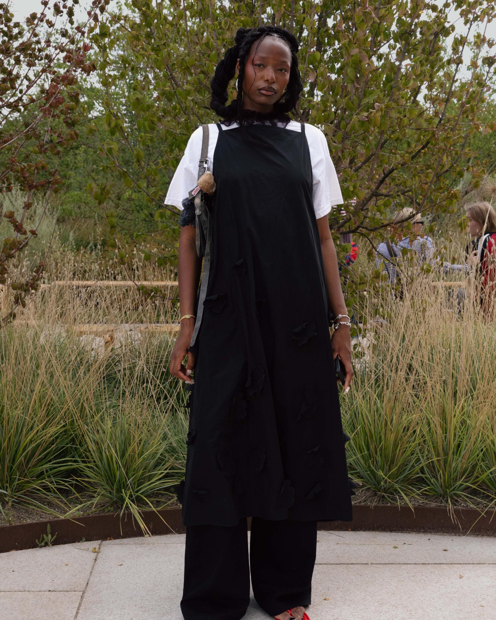 Jessi Reginan wearing black Marimekko dress and white t-shirt. 