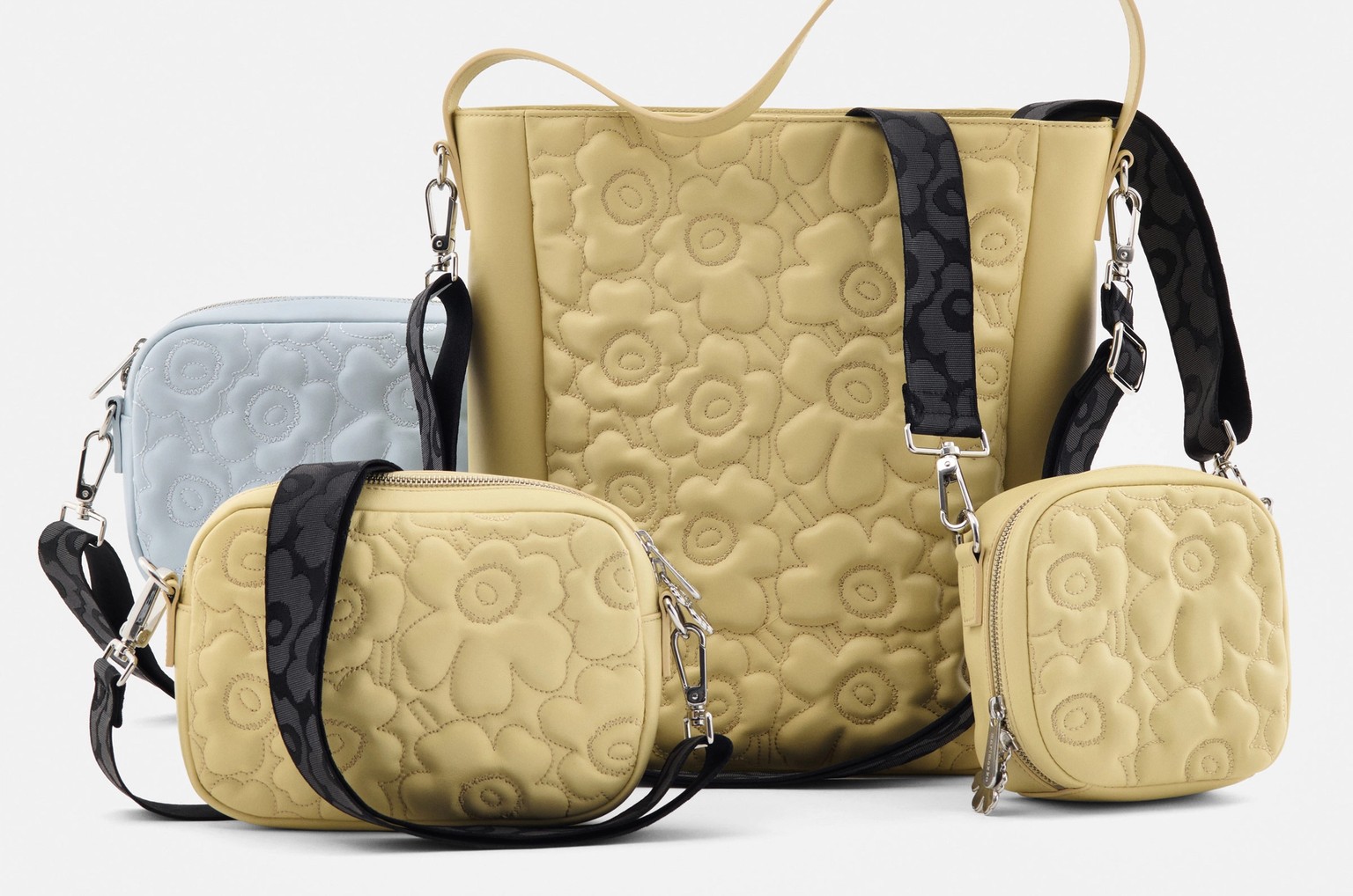 Yellow and light blue embroidered leather Gratha bags.