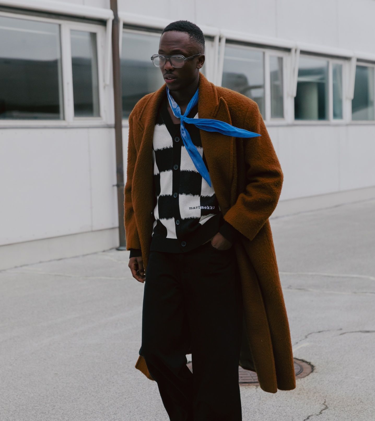 Florian Alexander in a black and white Marimekko cardigan and a blue Marimekko scarf