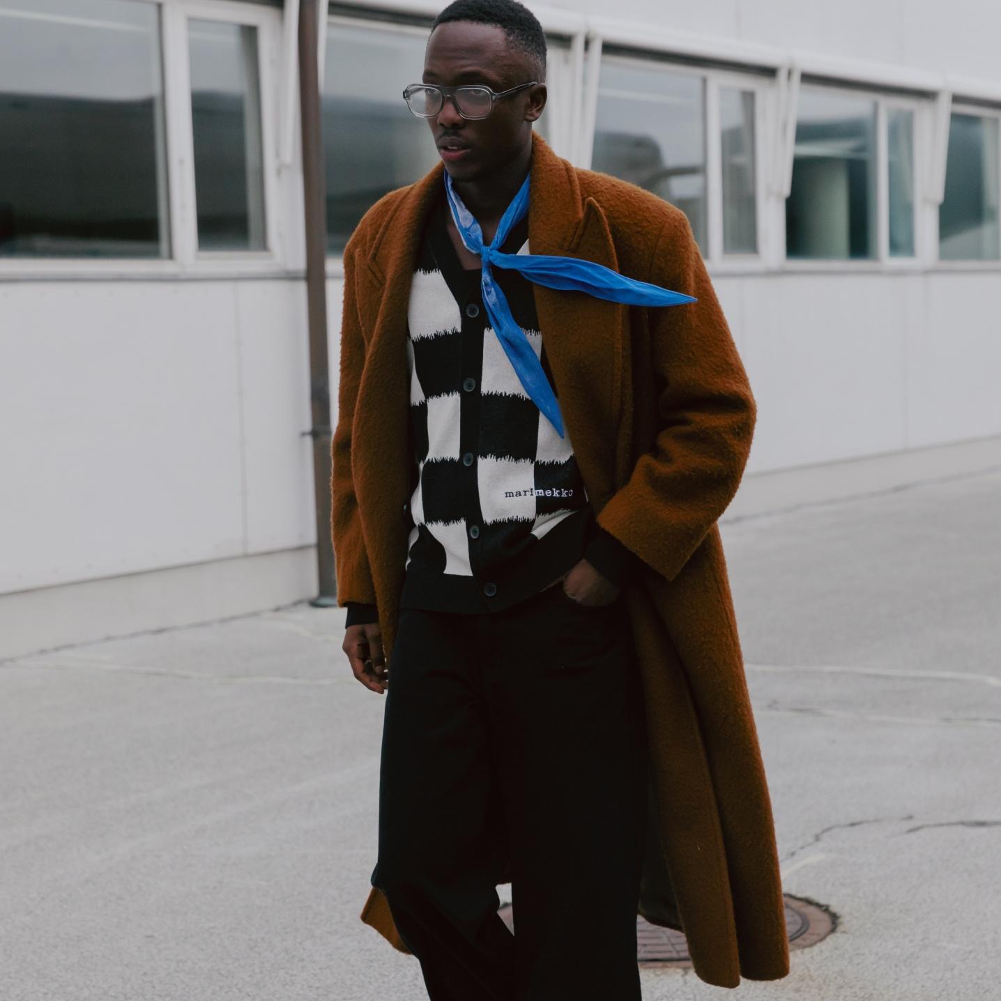 Florian Alexander in a black and white Marimekko cardigan and a blue Marimekko scarf