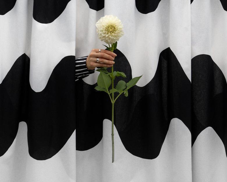 Picture of hand giving out a flower
