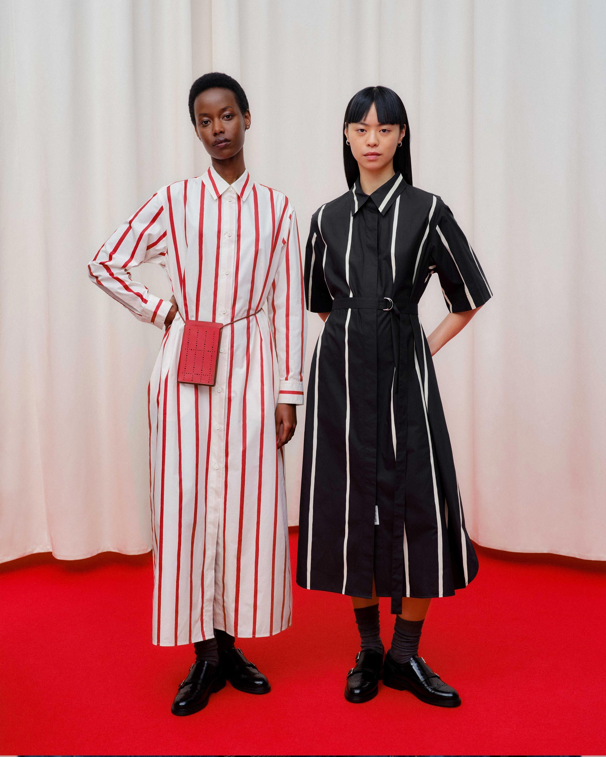 Models wearing Paperi and Muovata dresses in Puhveli print.