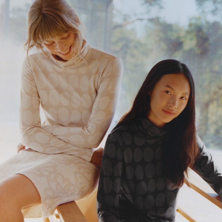 Models wearing Uniqlo and Marimekko collaboration dresses in beige and grey