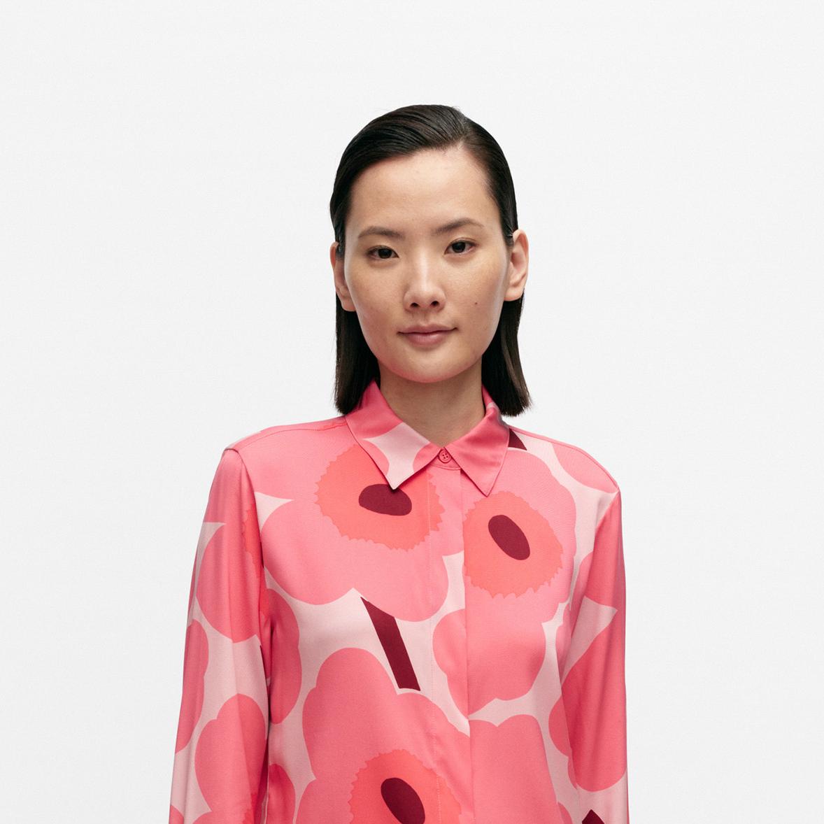 Model wearing a silk shirt in Unikko pattern.