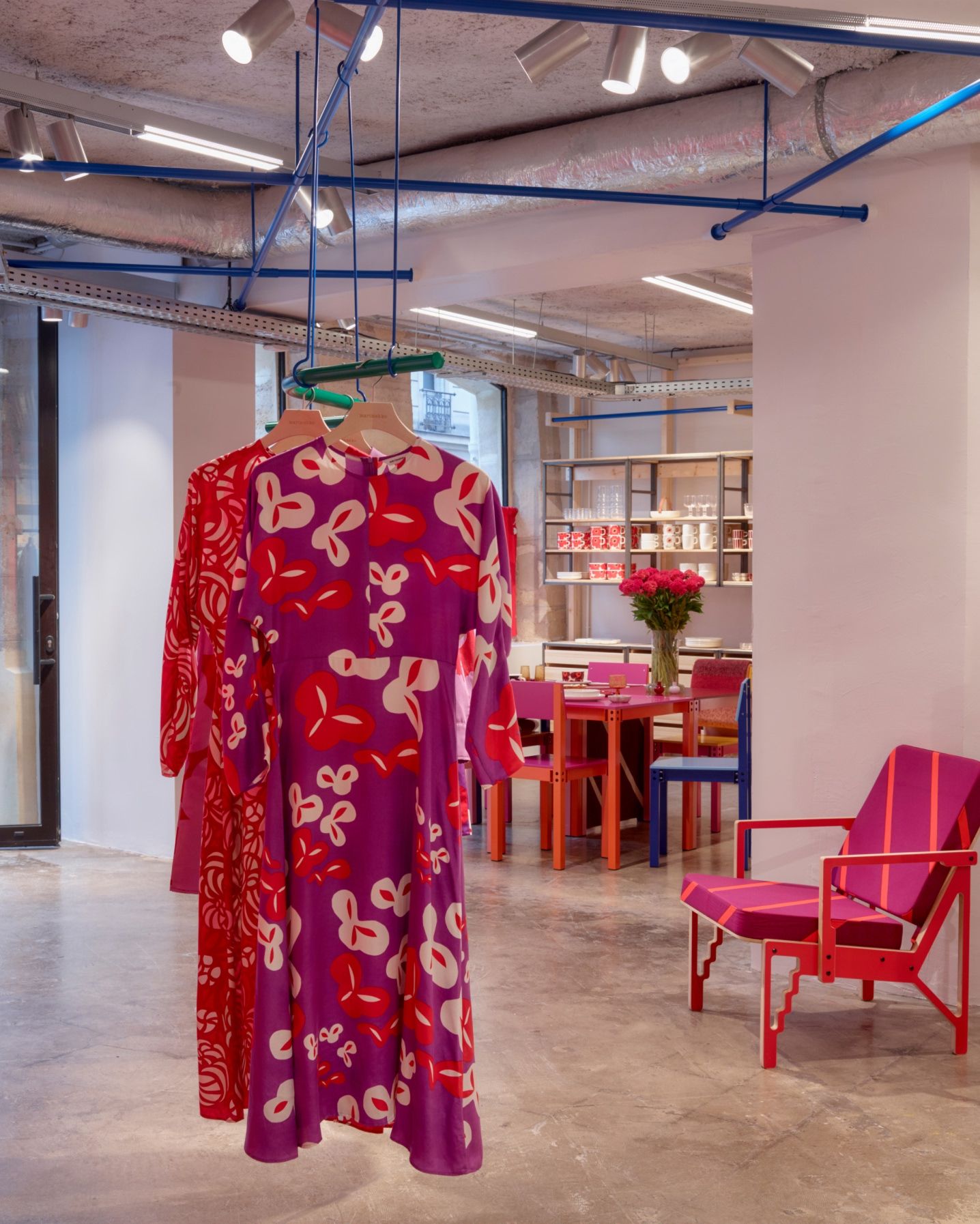 Dresses on hangers in the Marimekko Paris store.