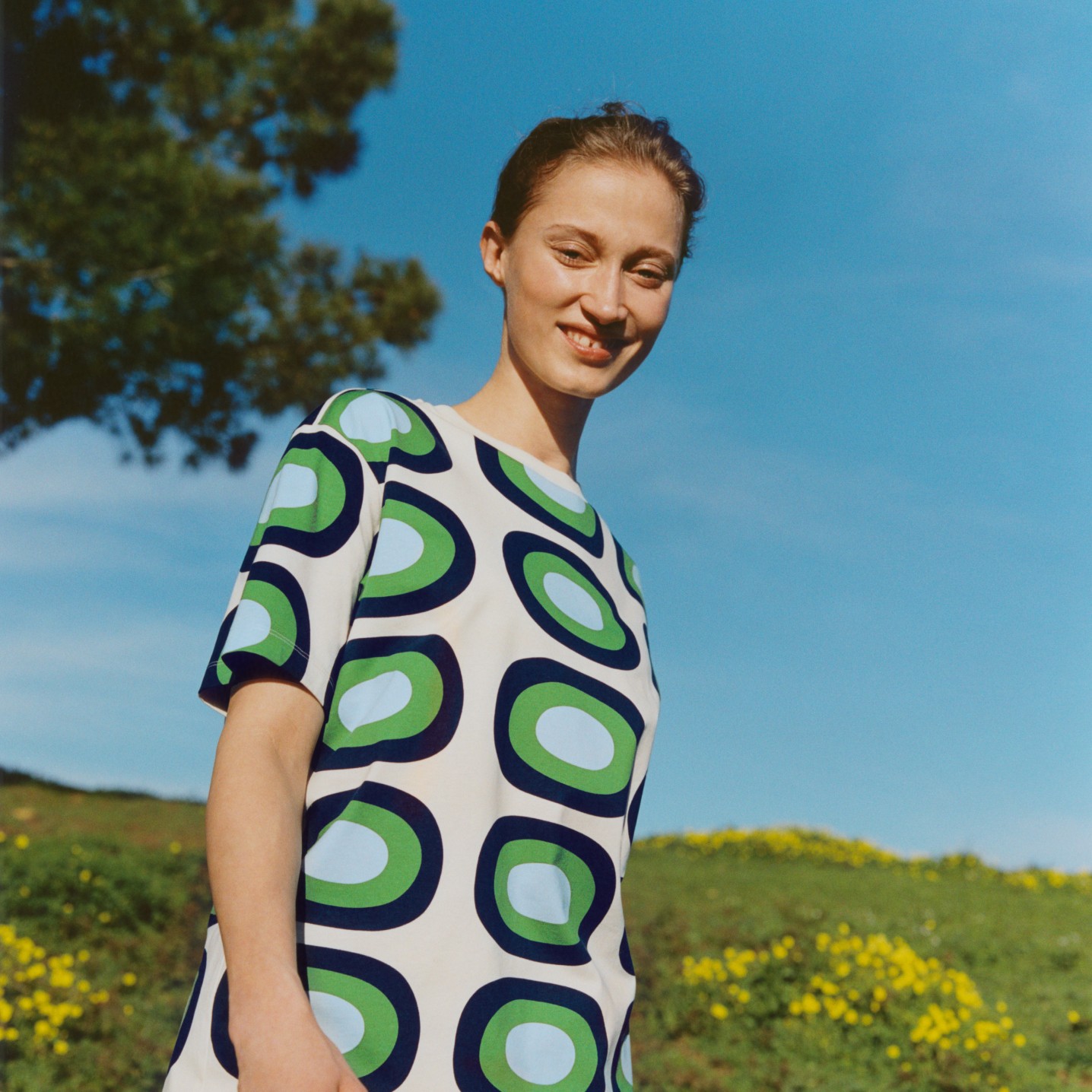 Model wearing Uniqlo and Marimekko collaboration dress in Melooni pattern