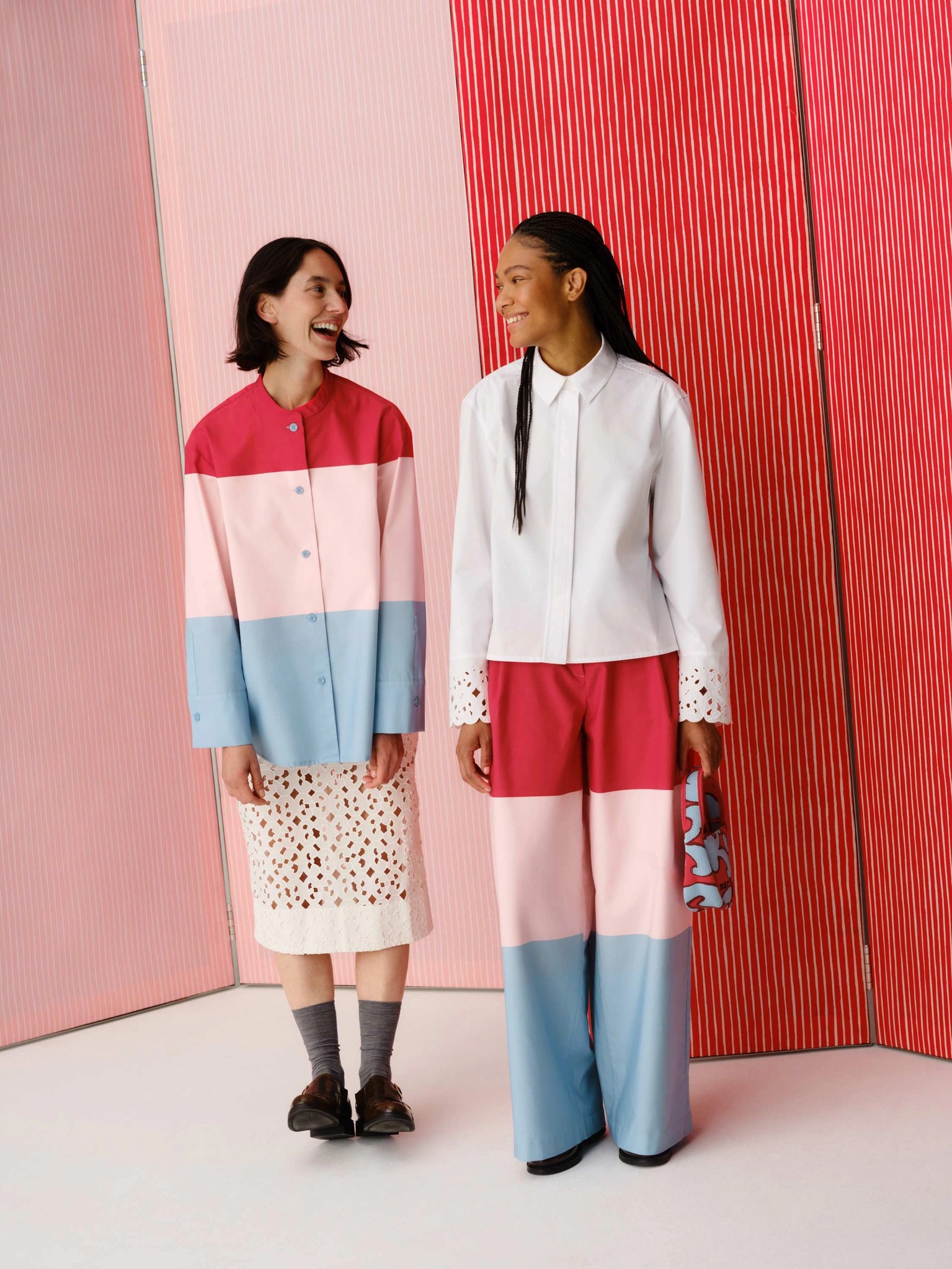 Models wearing shirt and pants in Hennika print.