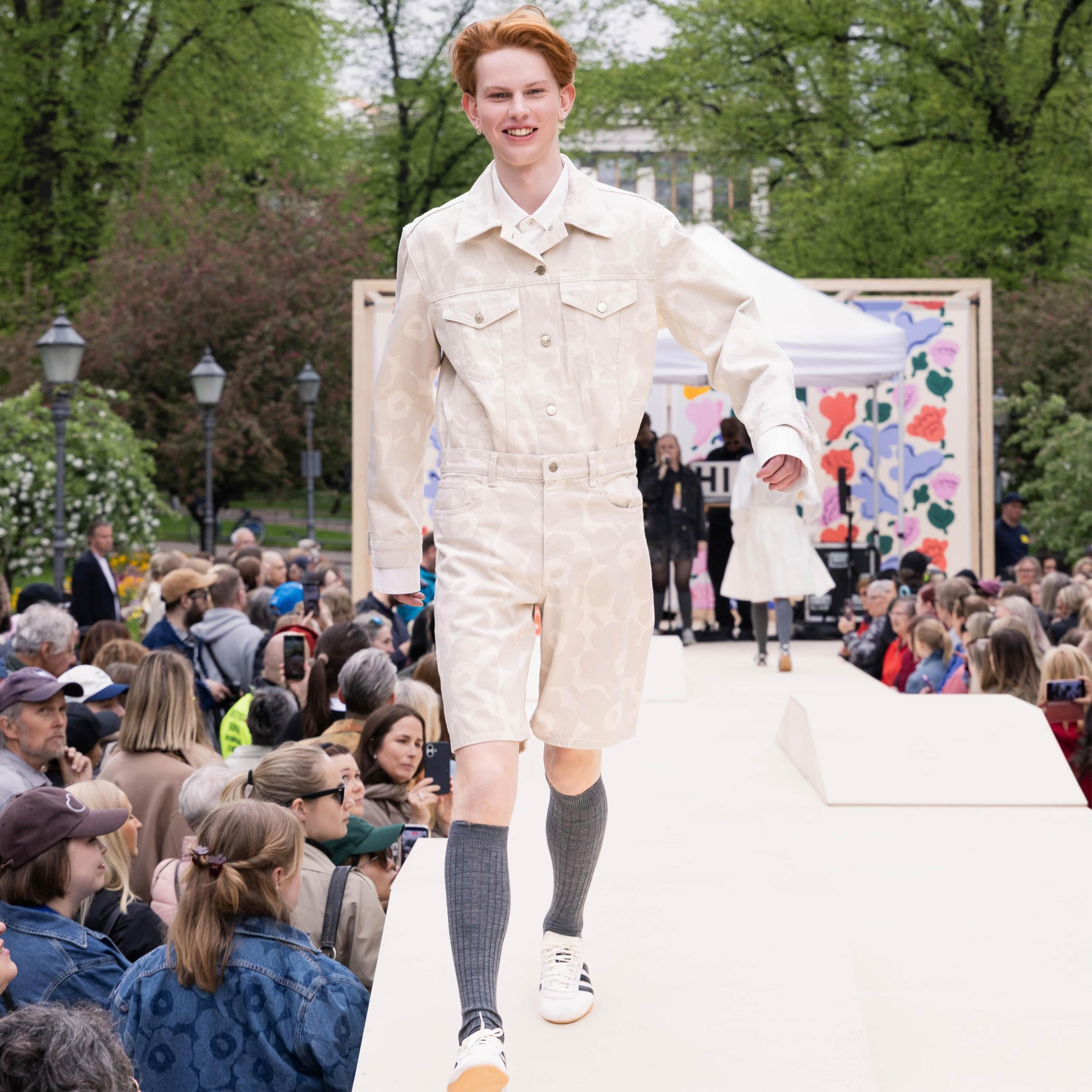 The Marimekko Day model walks on stage