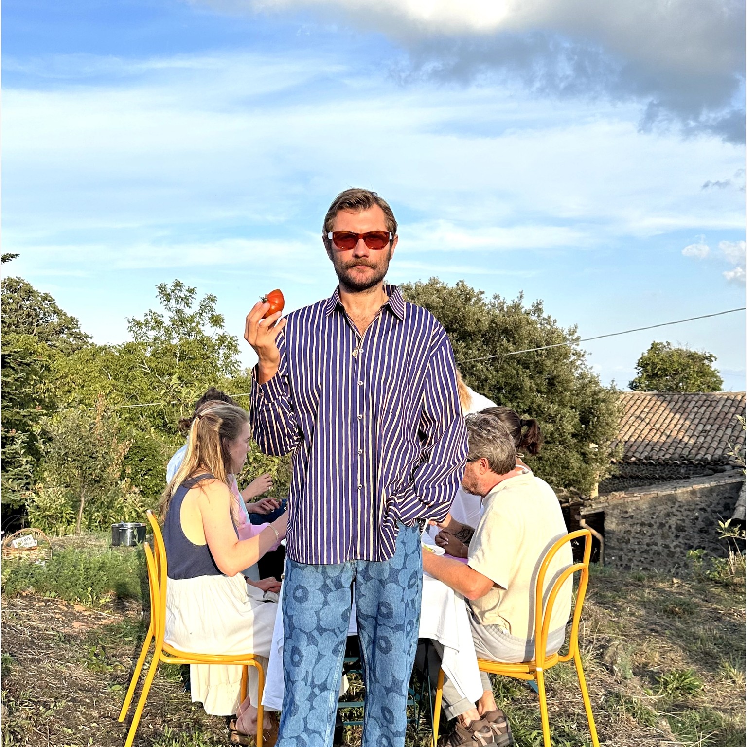 Lukas Lewandowski dressed in a Jokapoika shirt and Maridenim jeans in a Sicilian courtyard