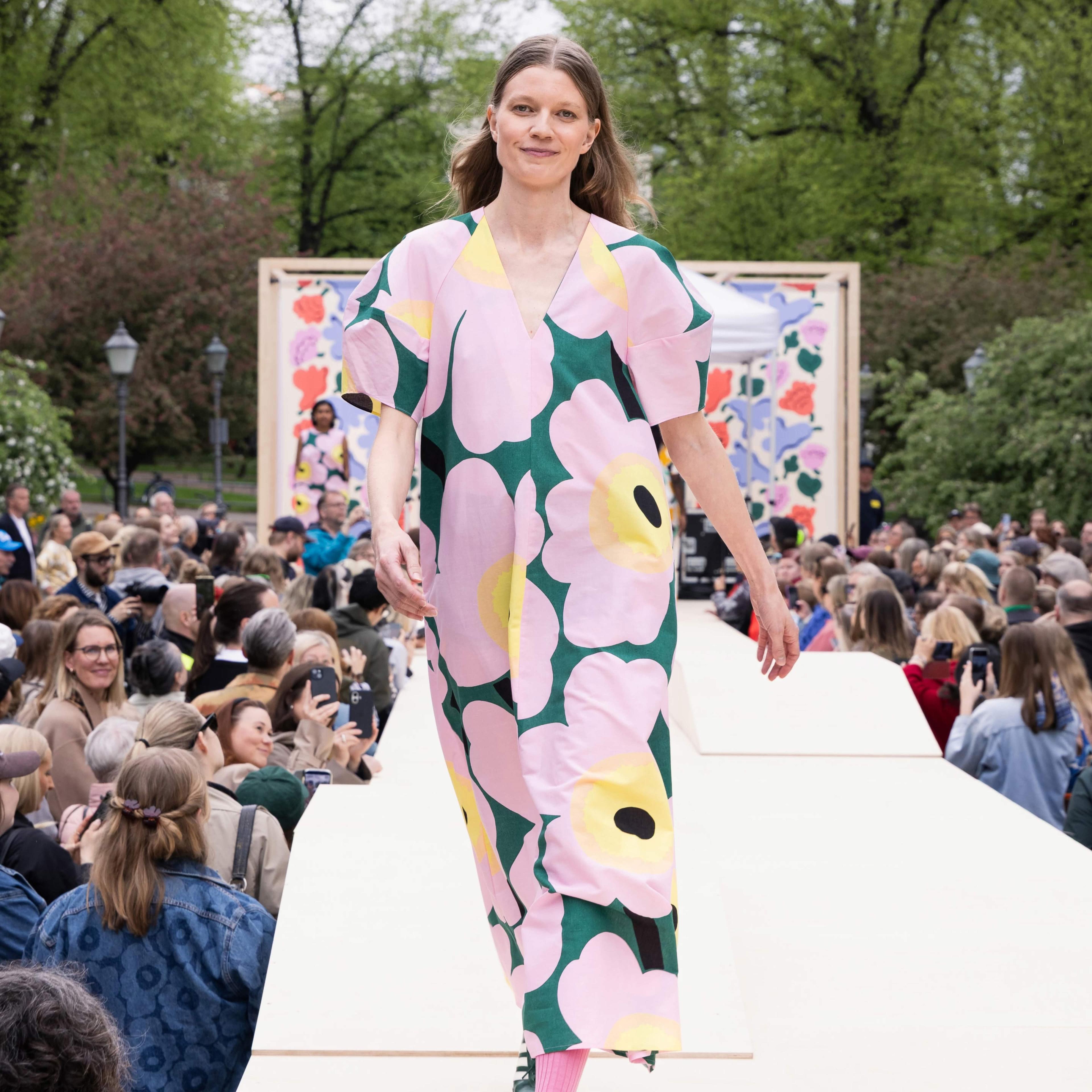 The Marimekko Day model walks on stage